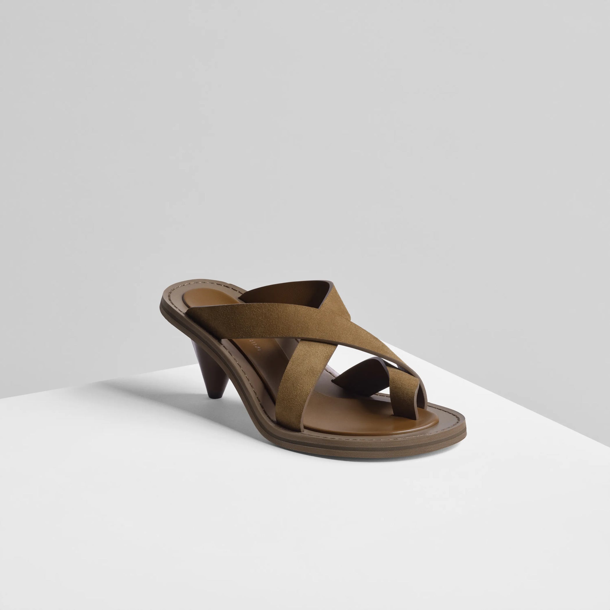 Angled view of strap sandal in caramel suede 