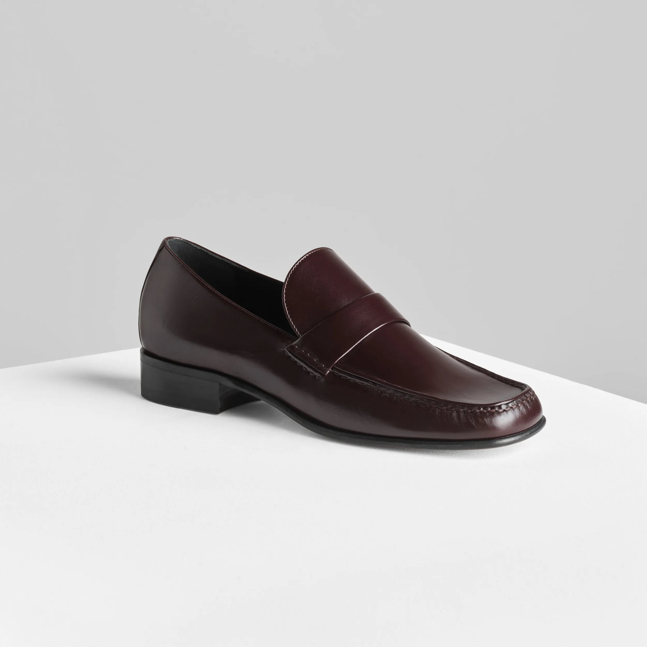 Side view of man&#39;s loafer in oxblood leather