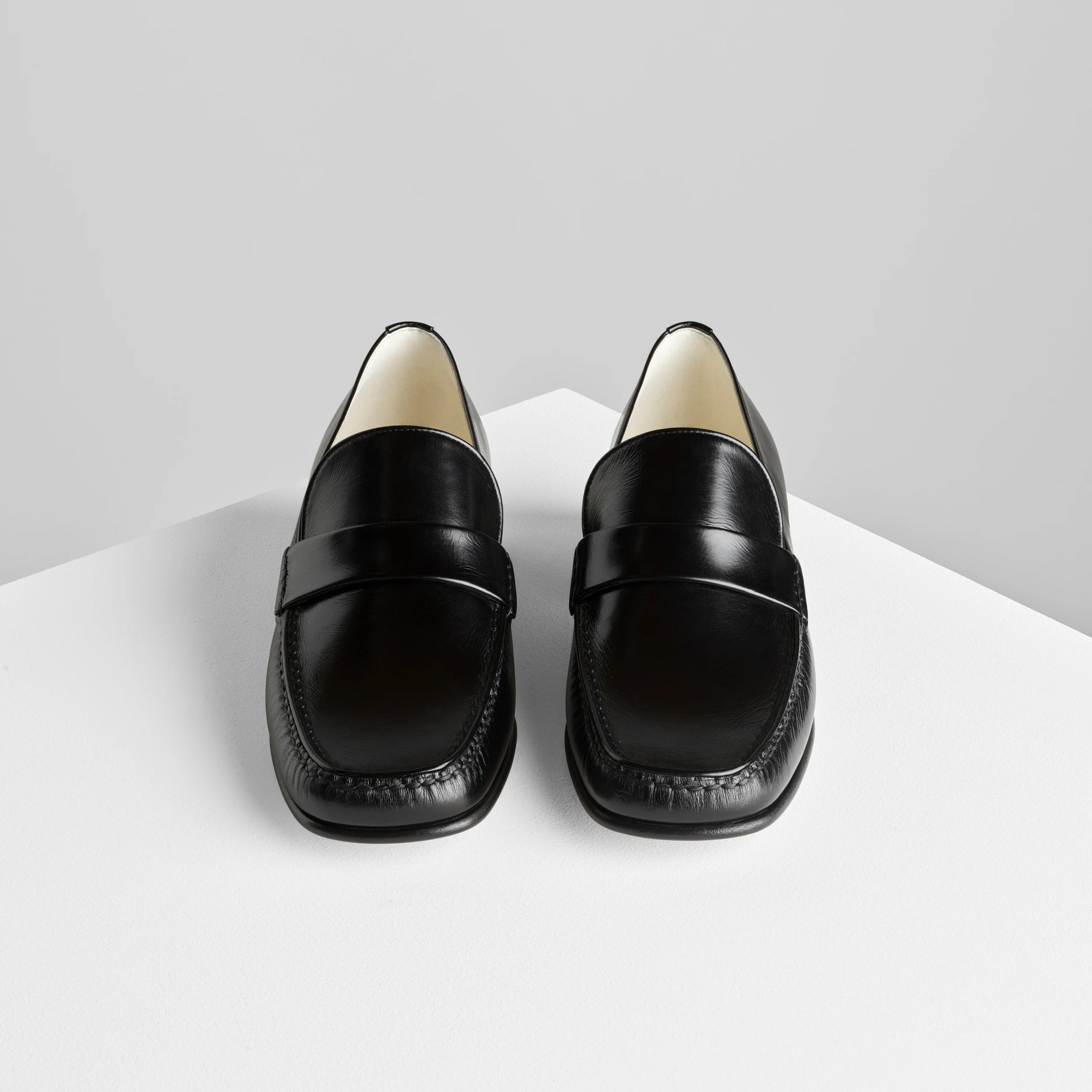 Front view of man’s loafer in black leather.