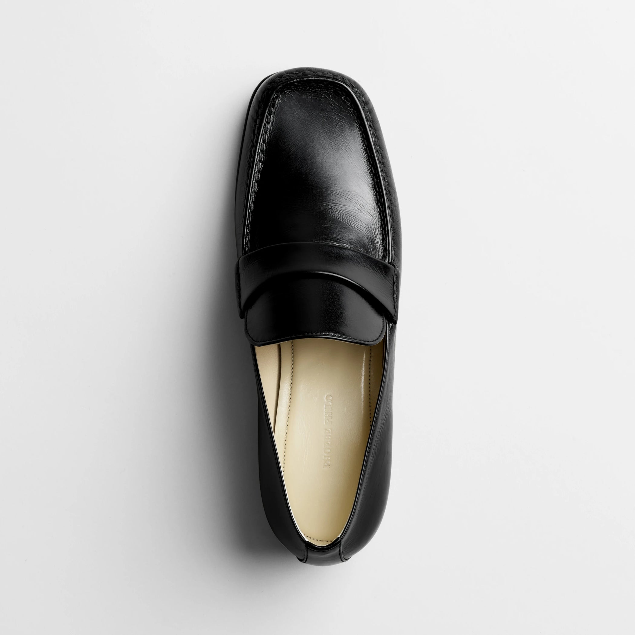 Top view of man’s loafer in black leather.