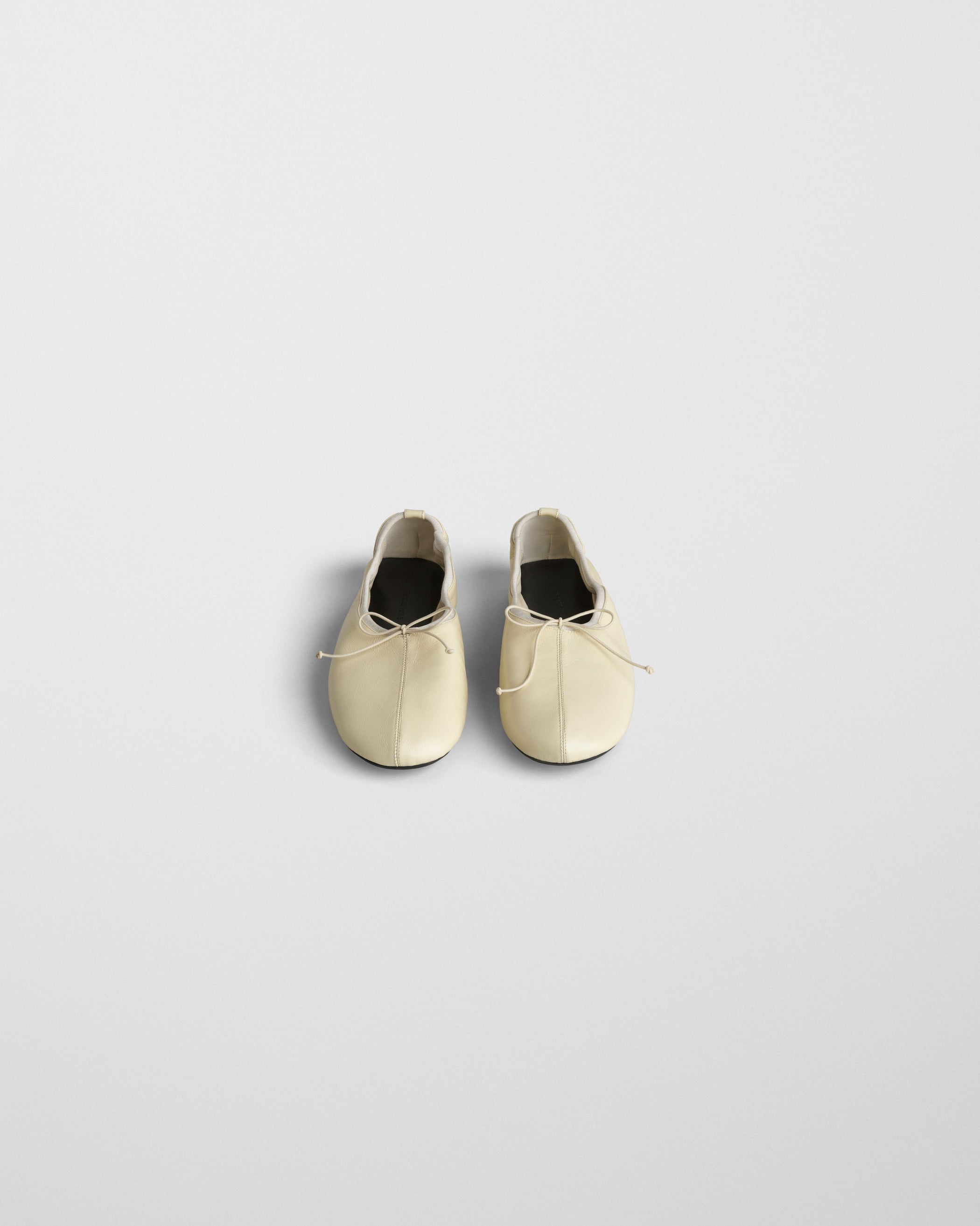 Front view of GATHERED FLAT in stucco leather