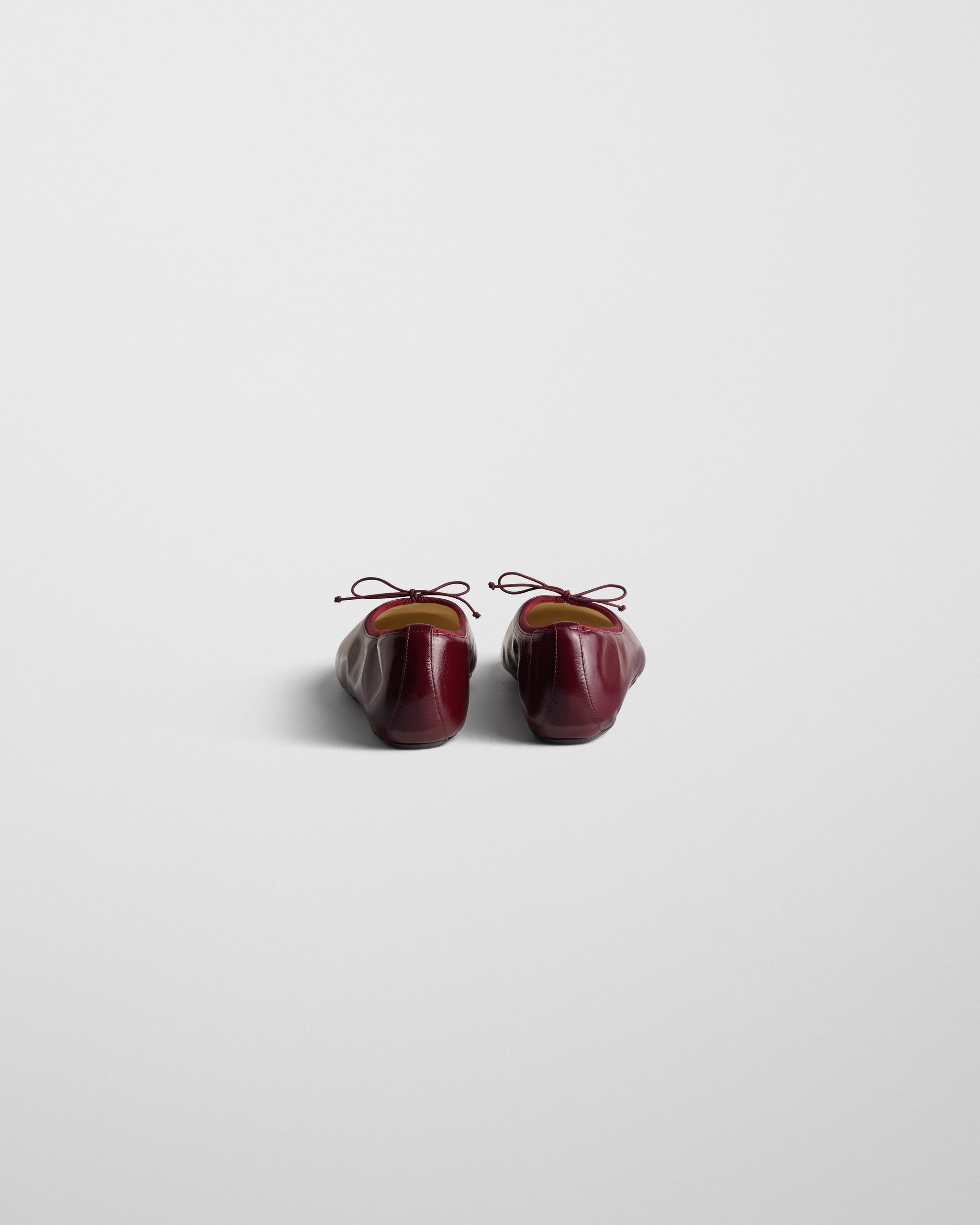 Back view of GATHERED FLAT in merlot leather