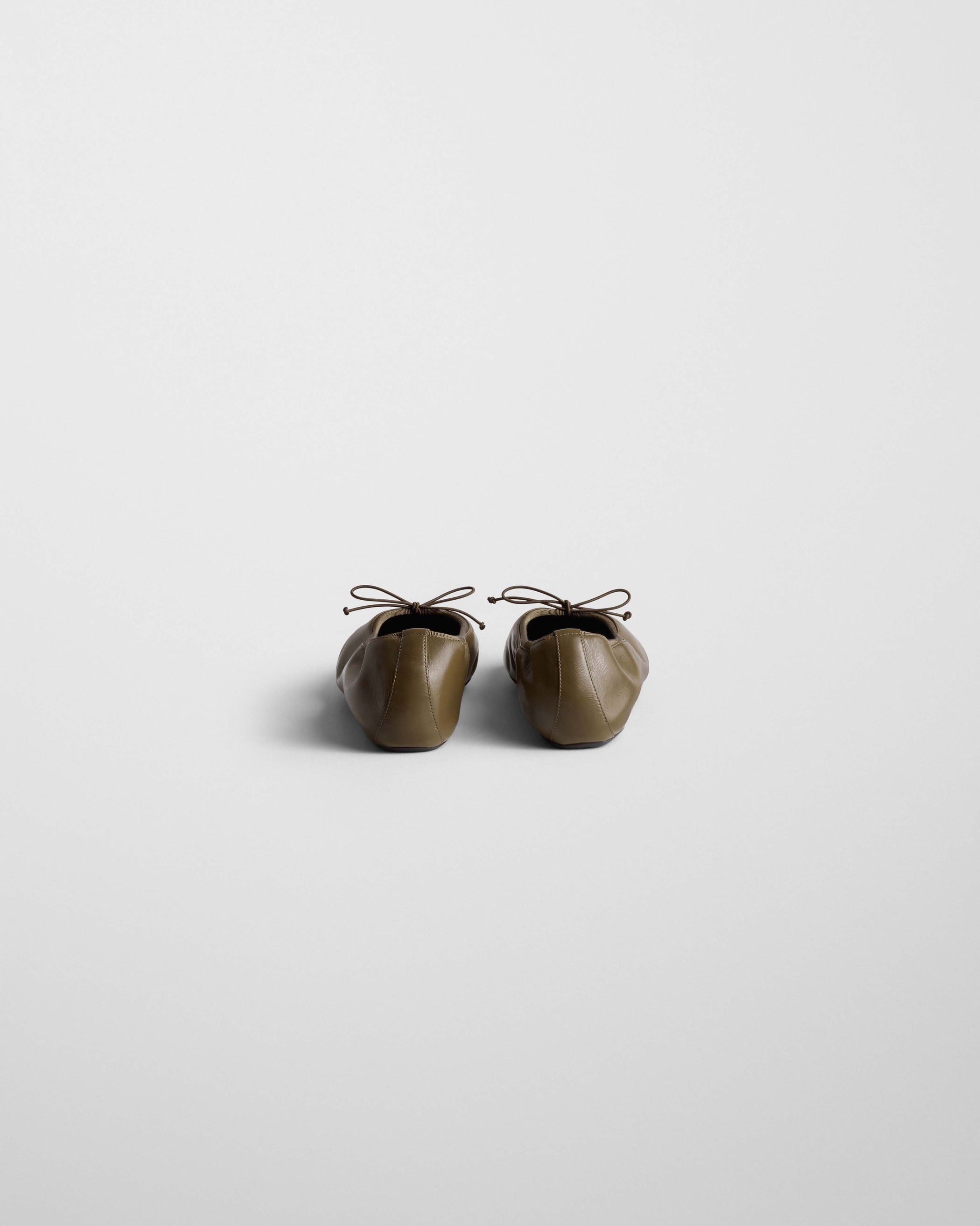 Back view of GATHERED FLAT in light mocha leather