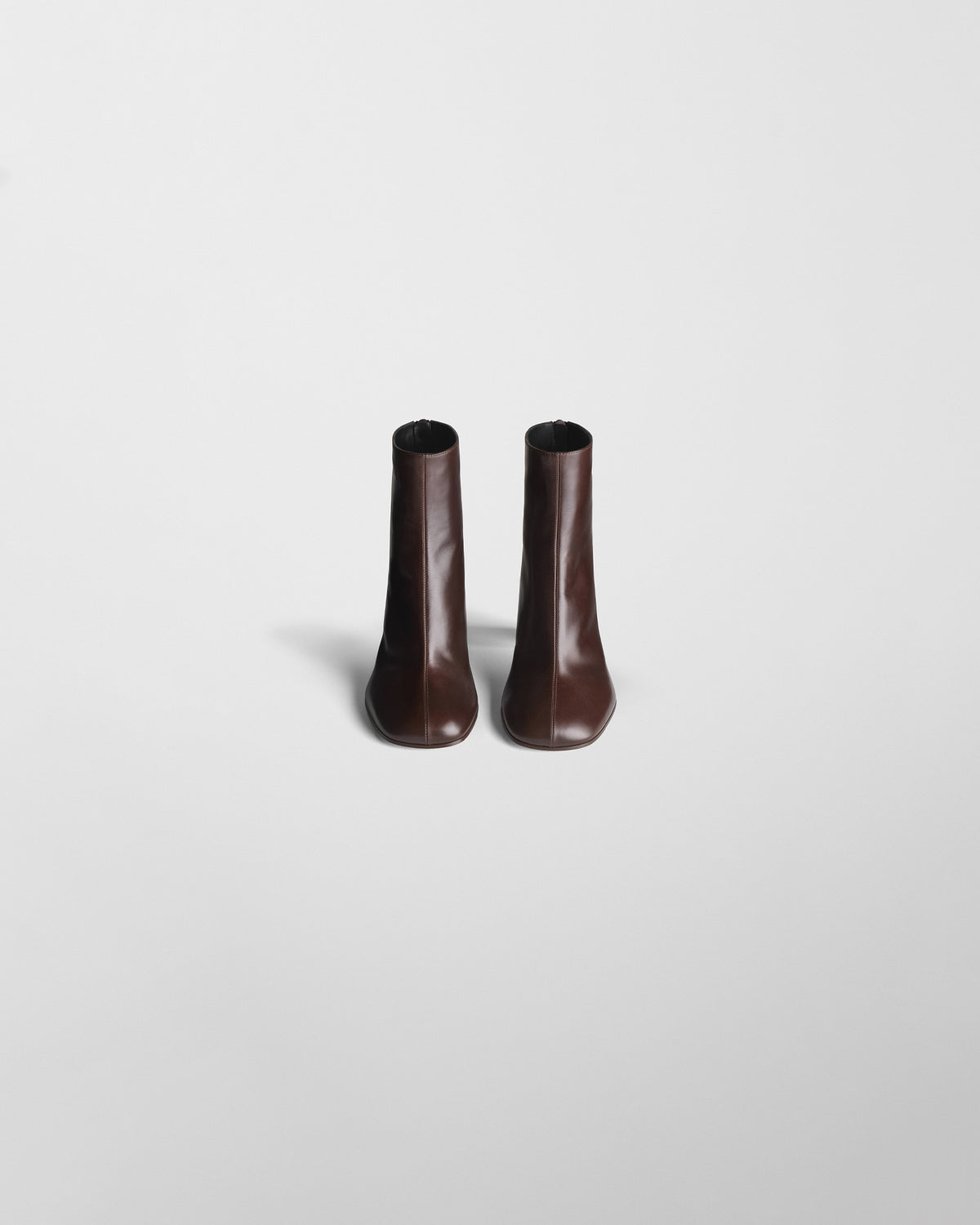 Front view of TUG ANKLE BOOT in plum brown leather