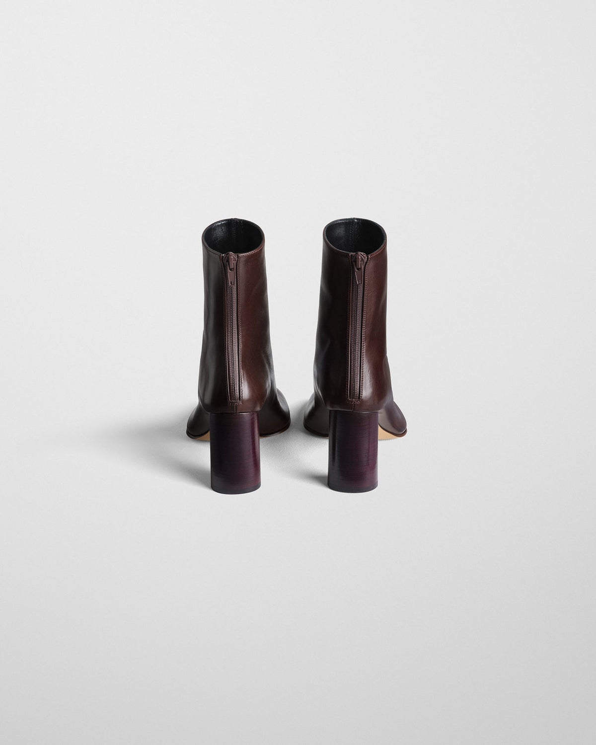 Back view of TUG ANKLE BOOT in plum brown leather