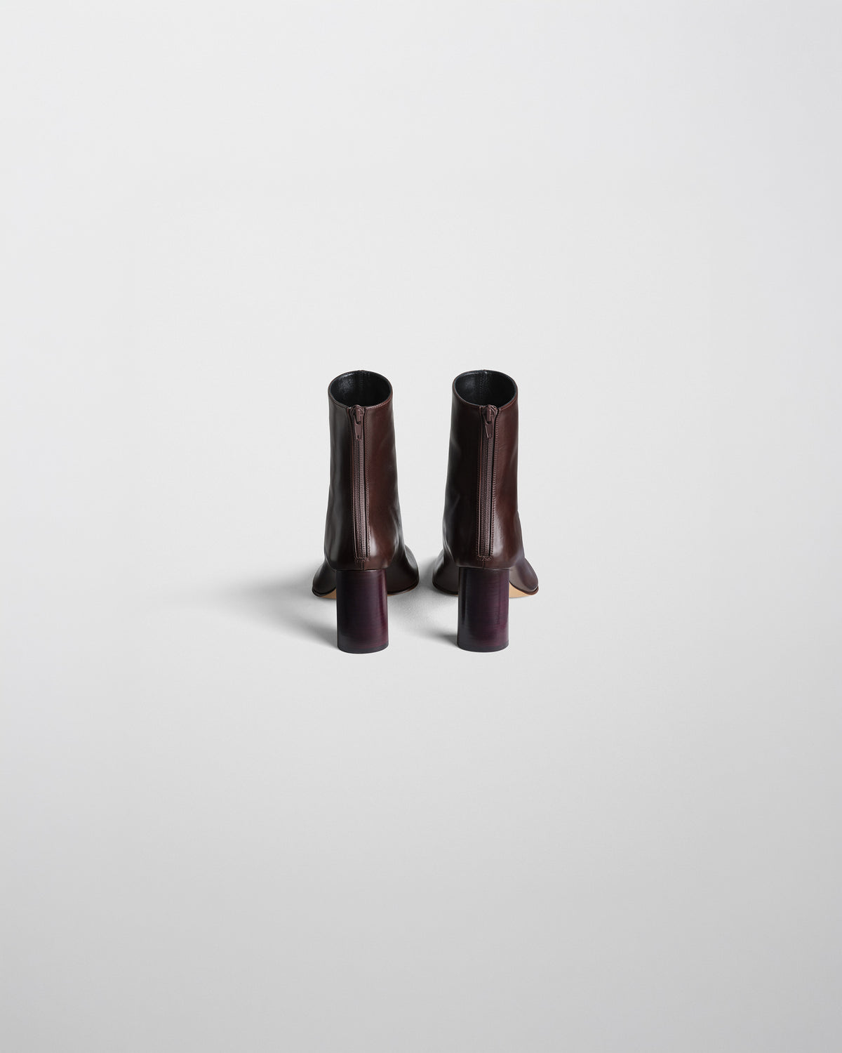 Back view of TUG ANKLE BOOT in plum brown leather