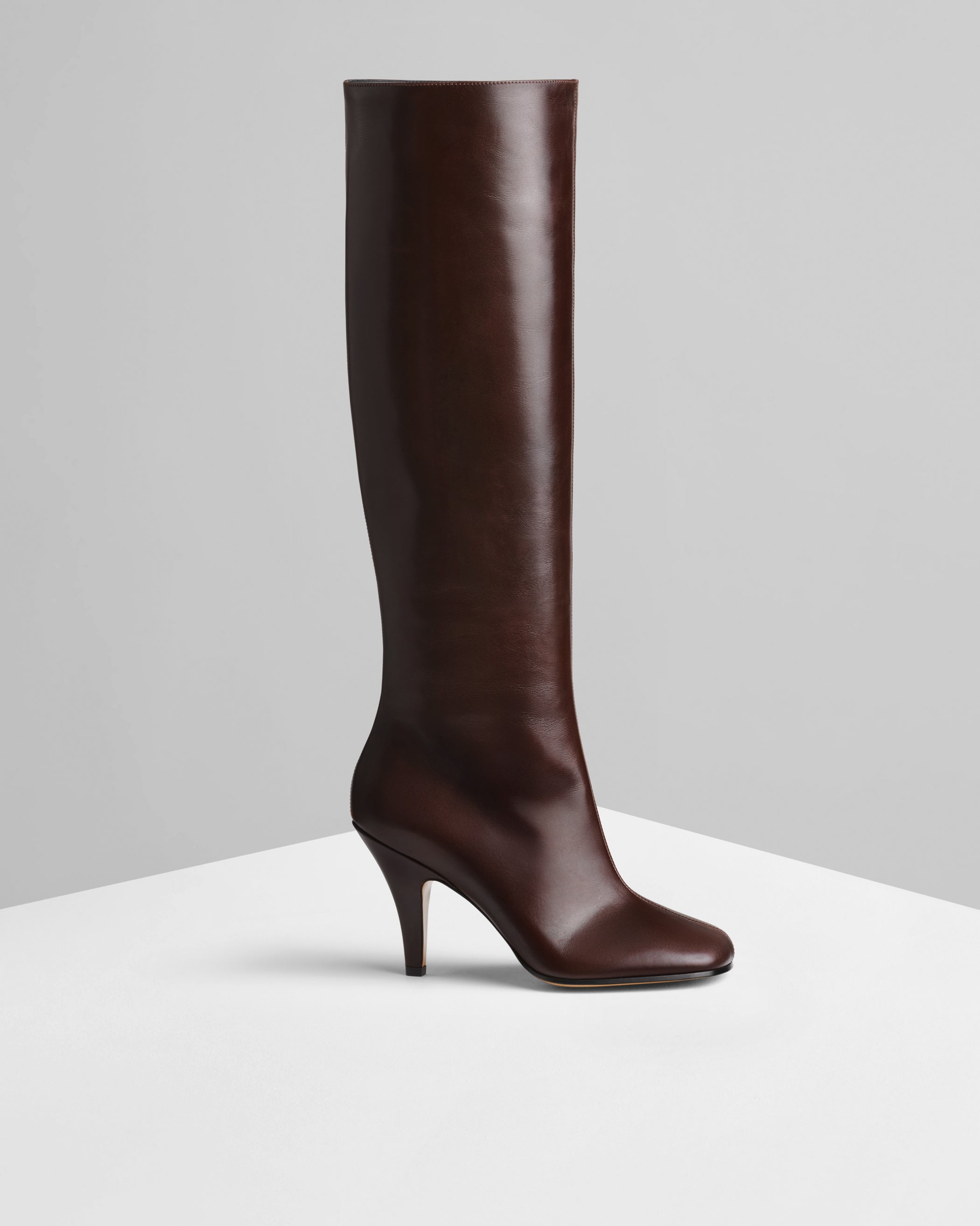 Side view of Knee-High Boot in oxblood leather