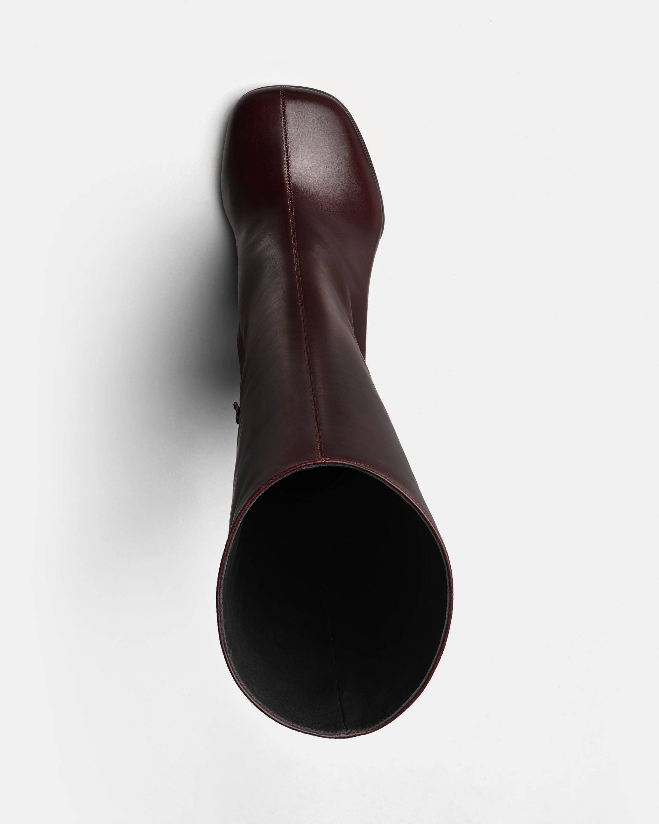 Flat front view of Knee-High Boot in oxblood leather