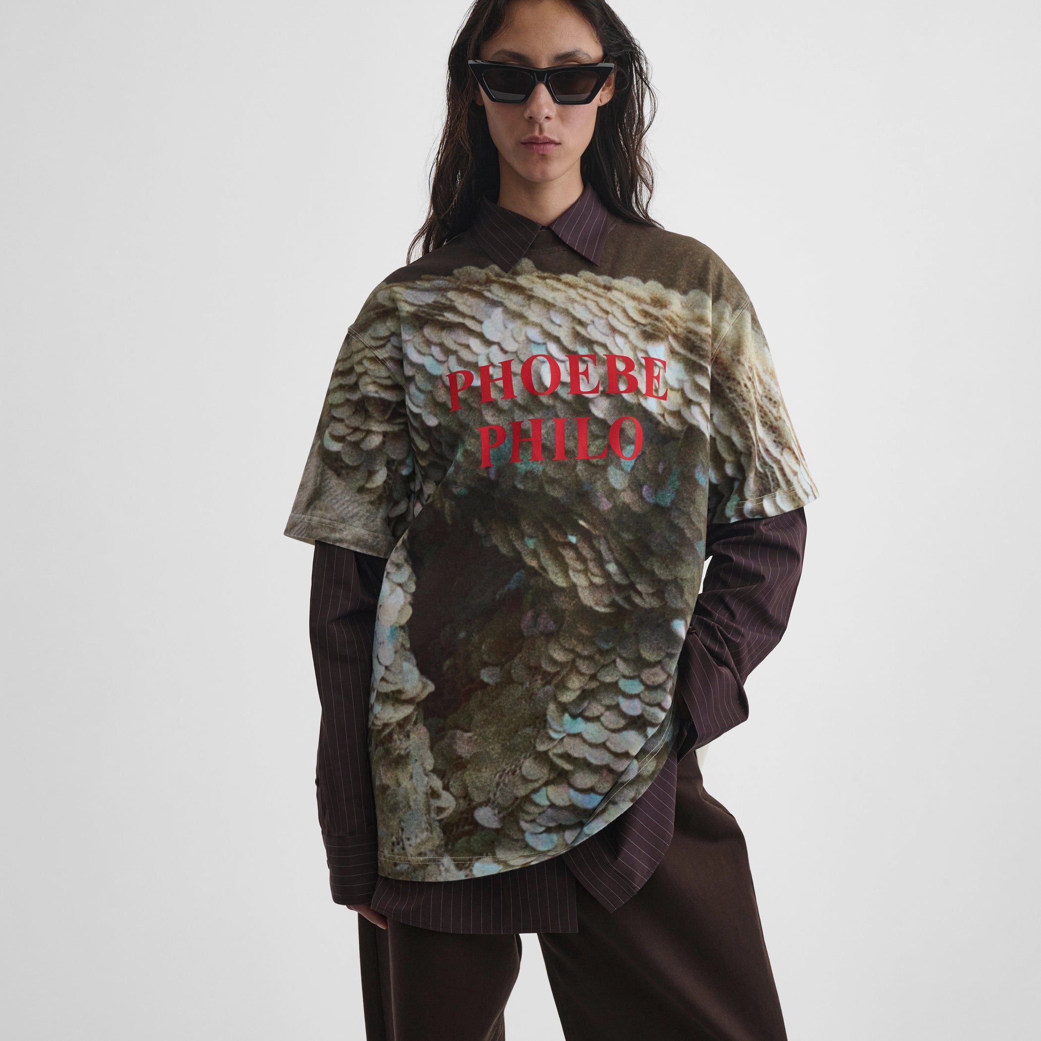 Front view of model wearing zine t-shirt in sequins print cotton