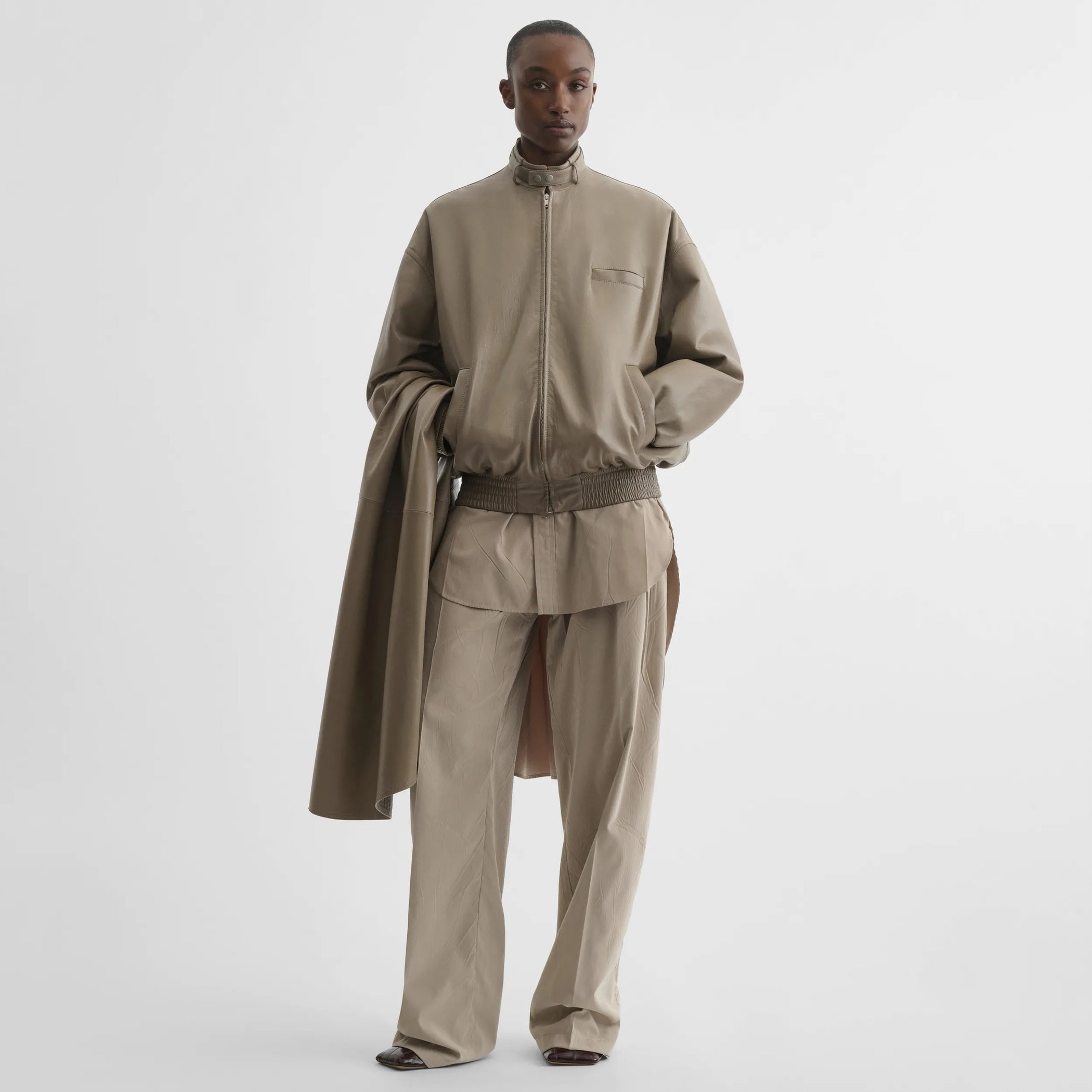Front view of jacket with attachable scarf in mastic leather