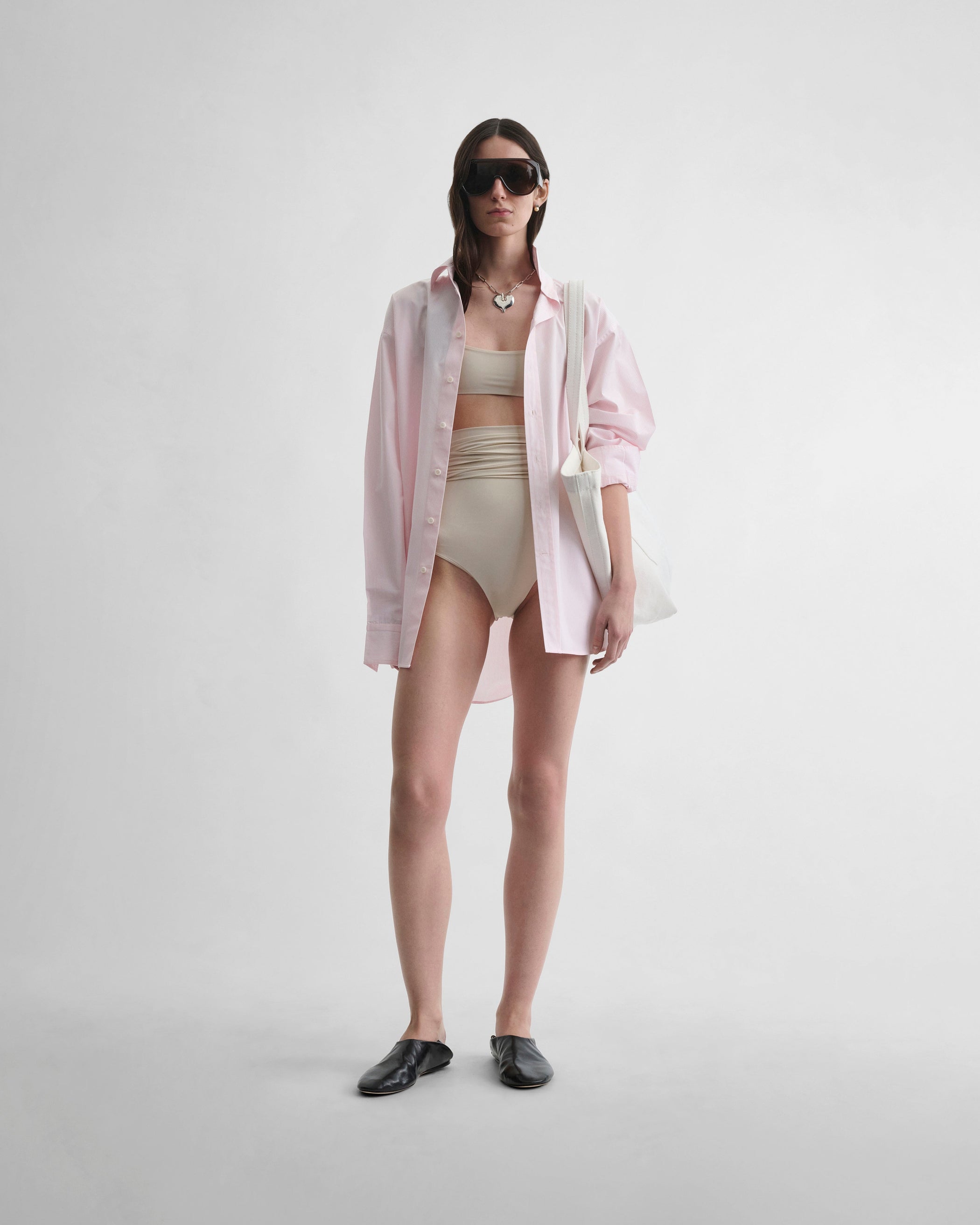 Front view of model wearing FOLD DOWN BIKINI BOTTOMS in stucco polyamide