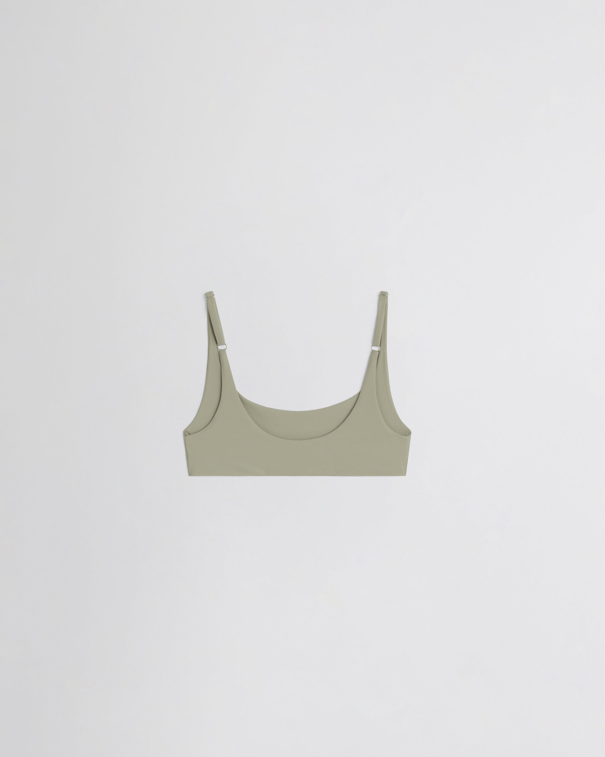 Flat back view of SCOOP BIKINI TOP in light sage polyamide