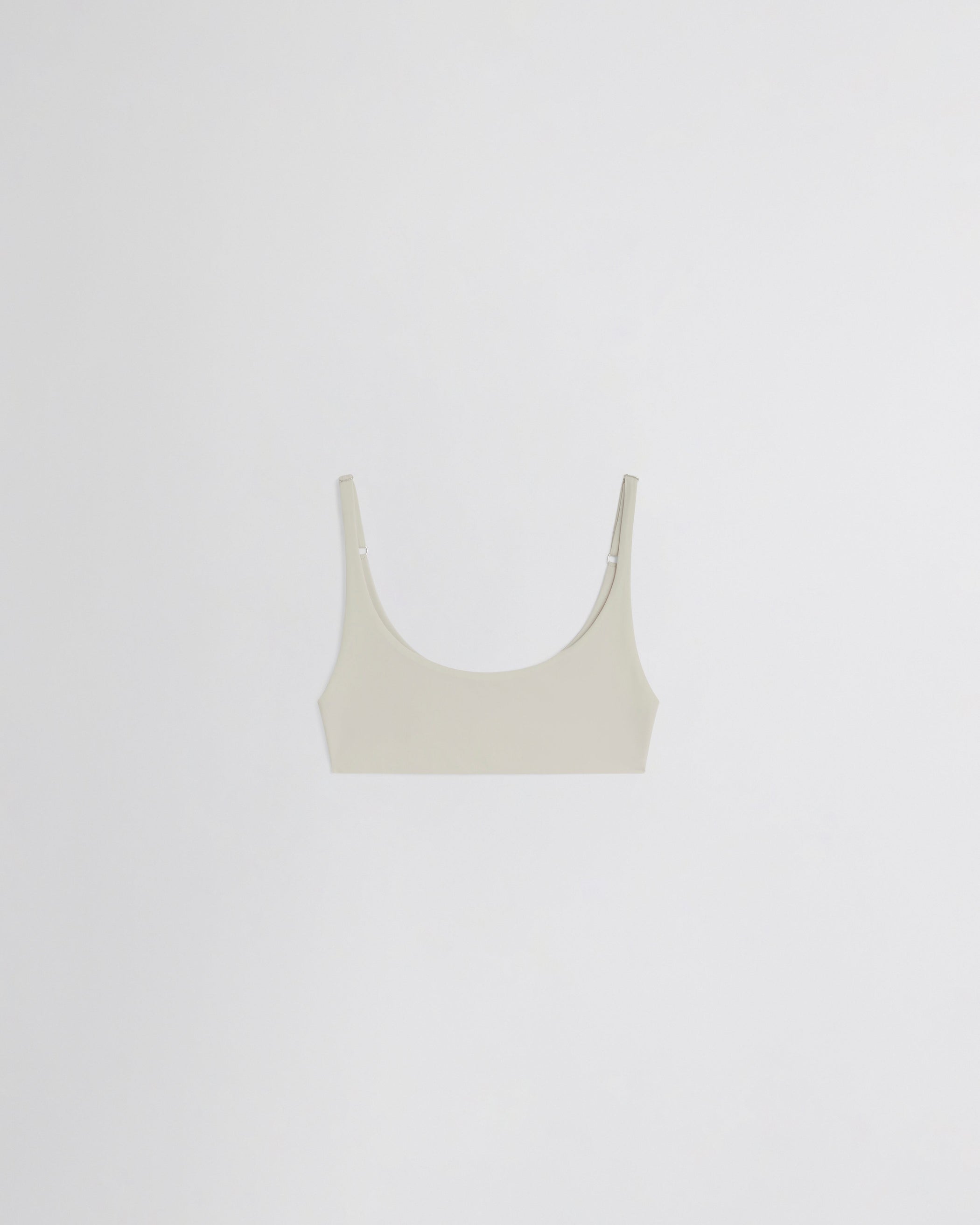 Flat front view of SCOOP BIKINI TOP in stucco polyamide