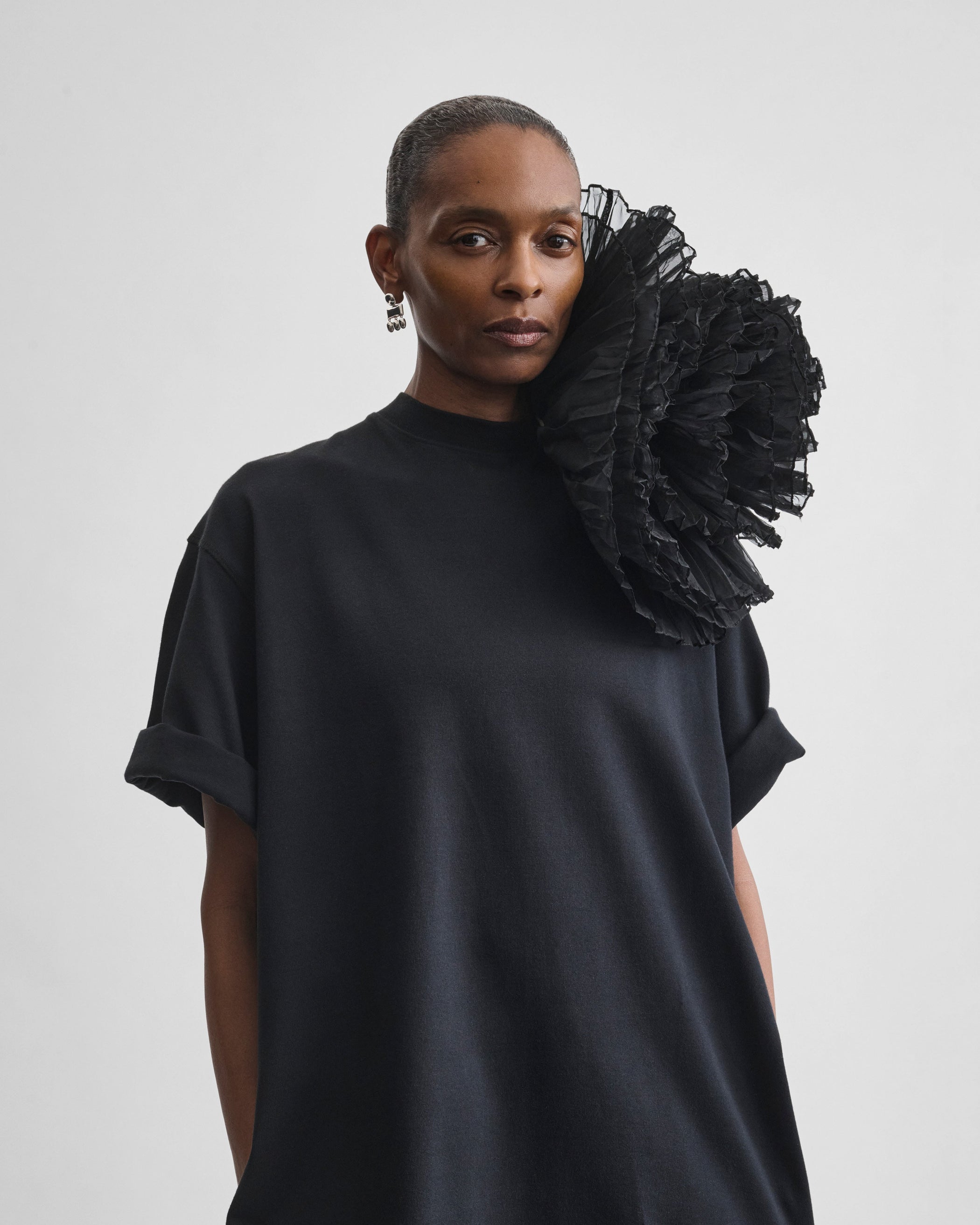 Model wearing FULL BLOOM BROOCH in black silk