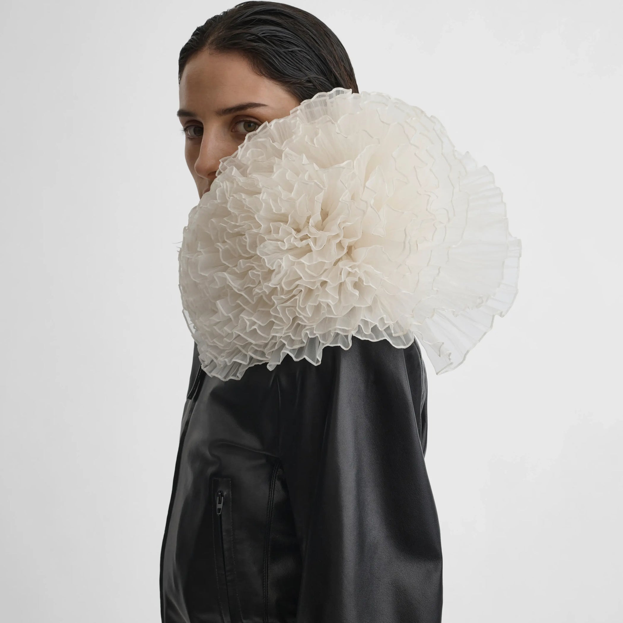 Side view of model wearing Big Bloom Brooch in white. 