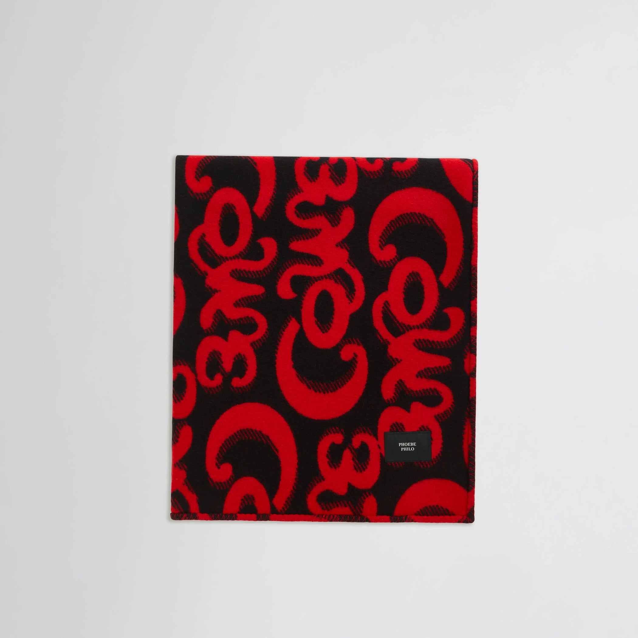 Flat lay view of Doodle Blanket in red/black.