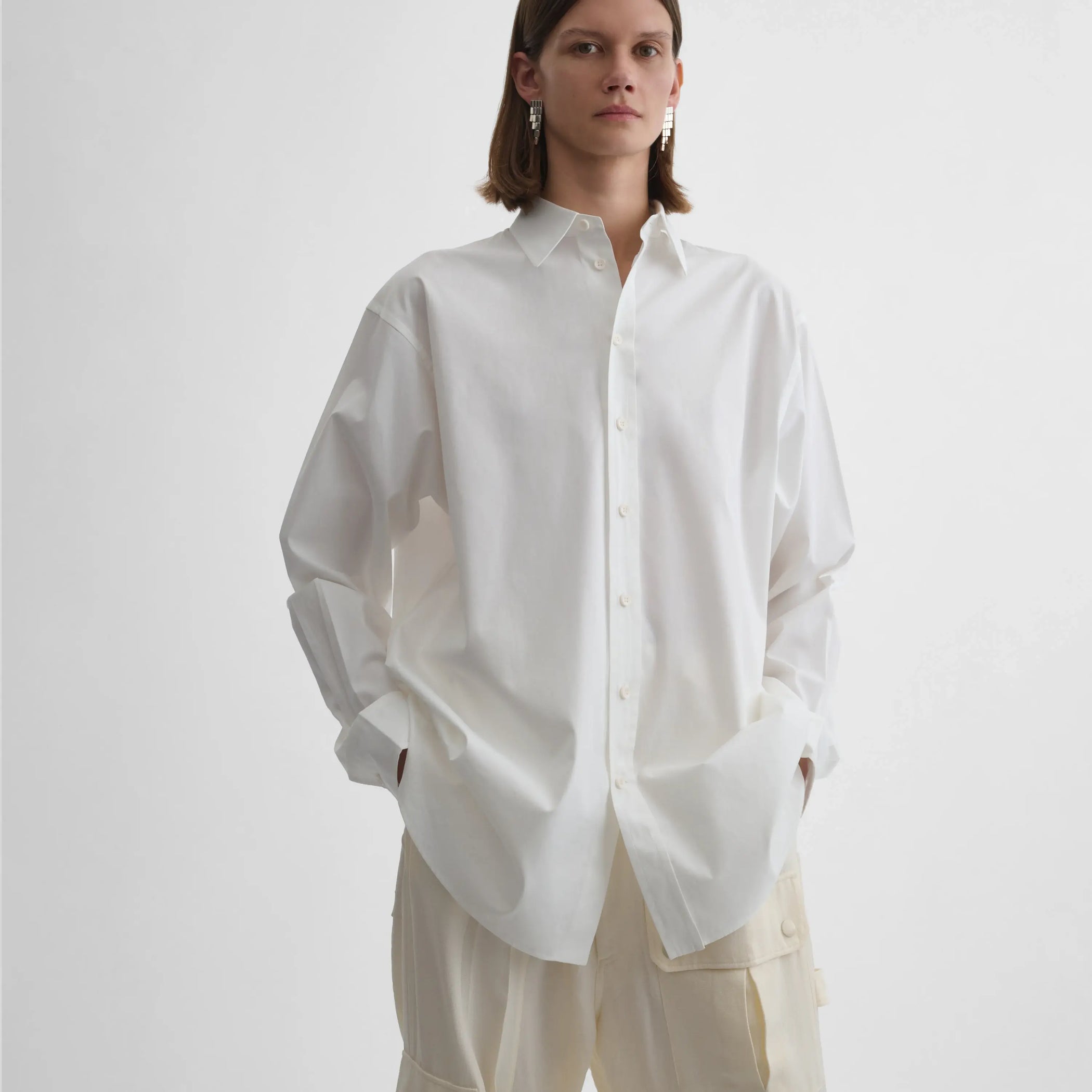 Front view of model wearing Sharp Collar Shirt in white.