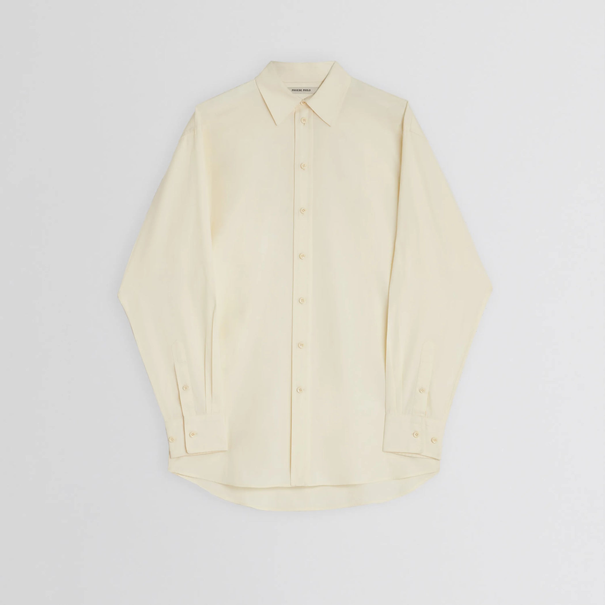 Flat front view of sharp collar shirt in light yellow cotton 