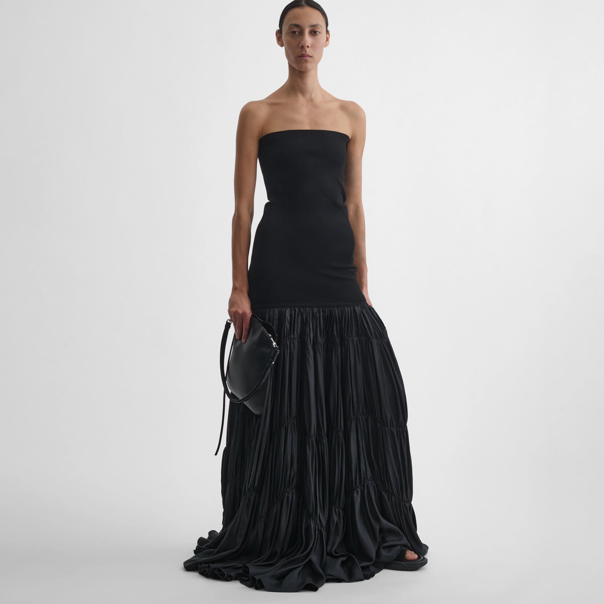 Front view of model wearing the parachute skirt in black
