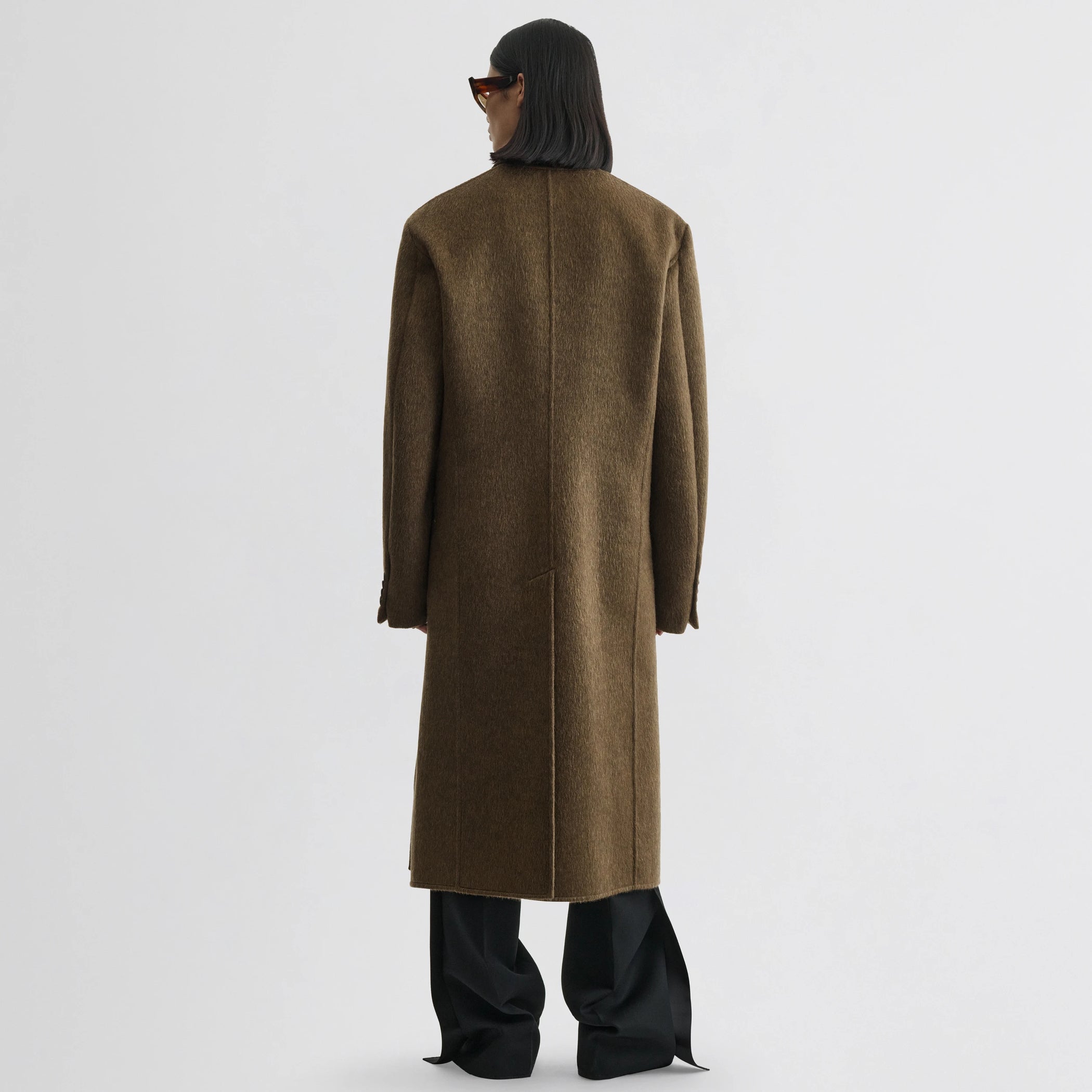 Close up detail view of man&#39;s coat in bronze khaki wool mohair.