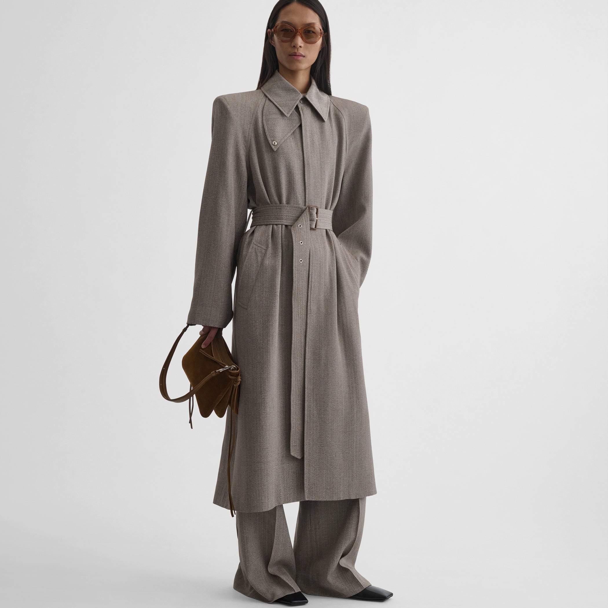 Front view of model wearing the sharp shoulder car coat in pebble melange
