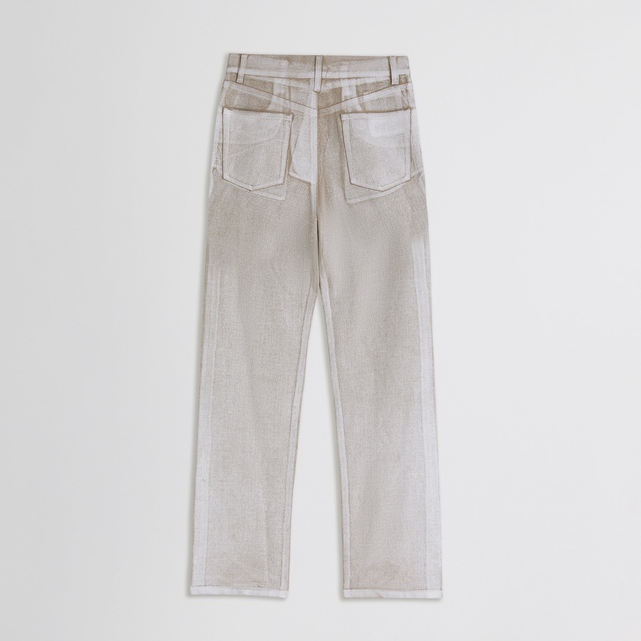 Flat lay back view of classic jeans in hay