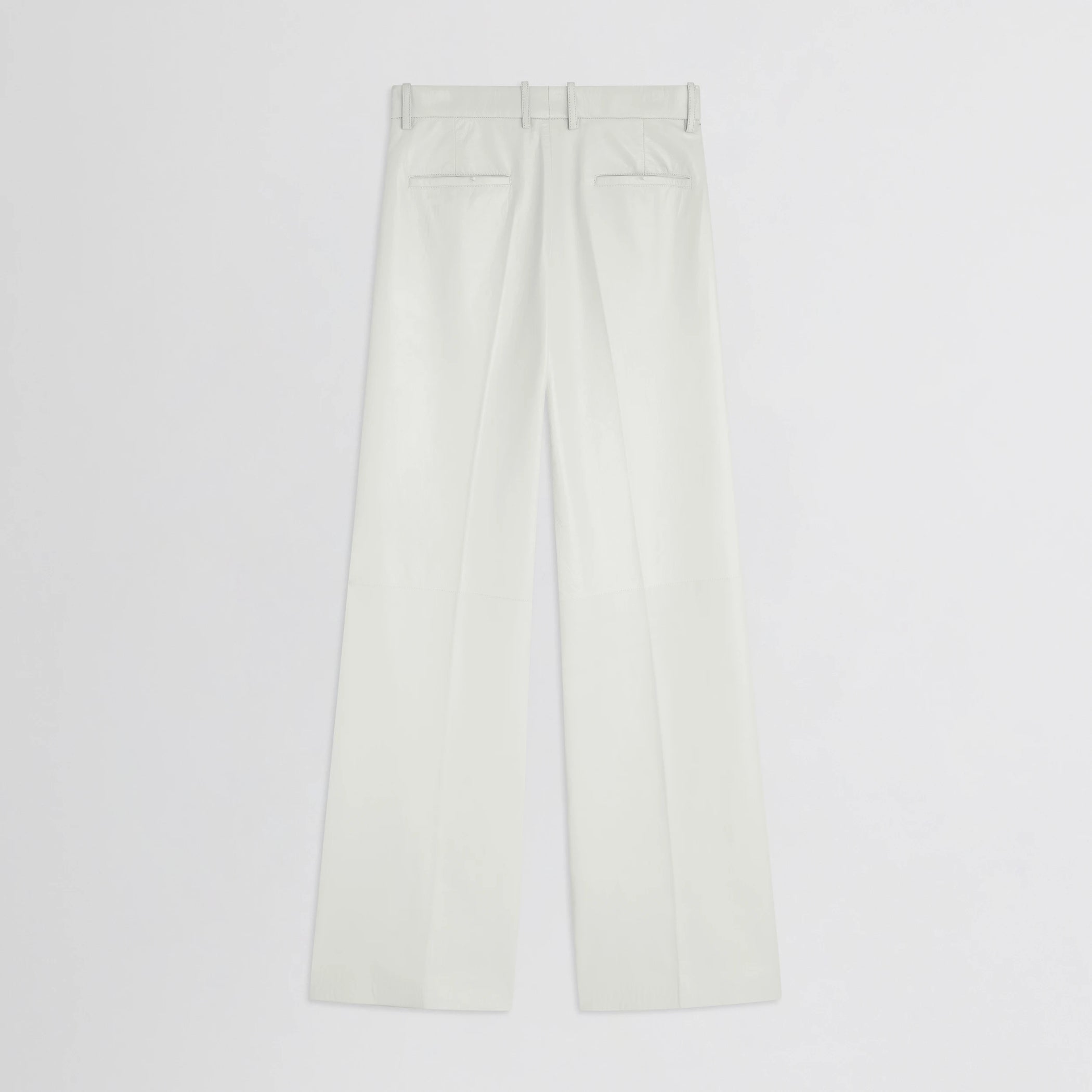 Flat back view of boyish trousers in white leather.