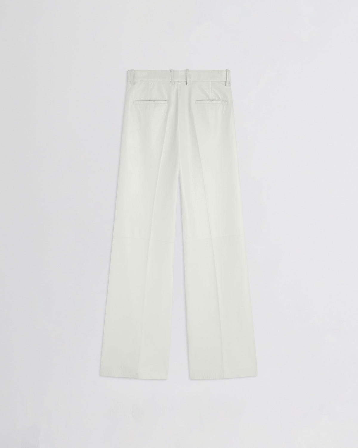 Flat back view of boyish trousers in white leather.
