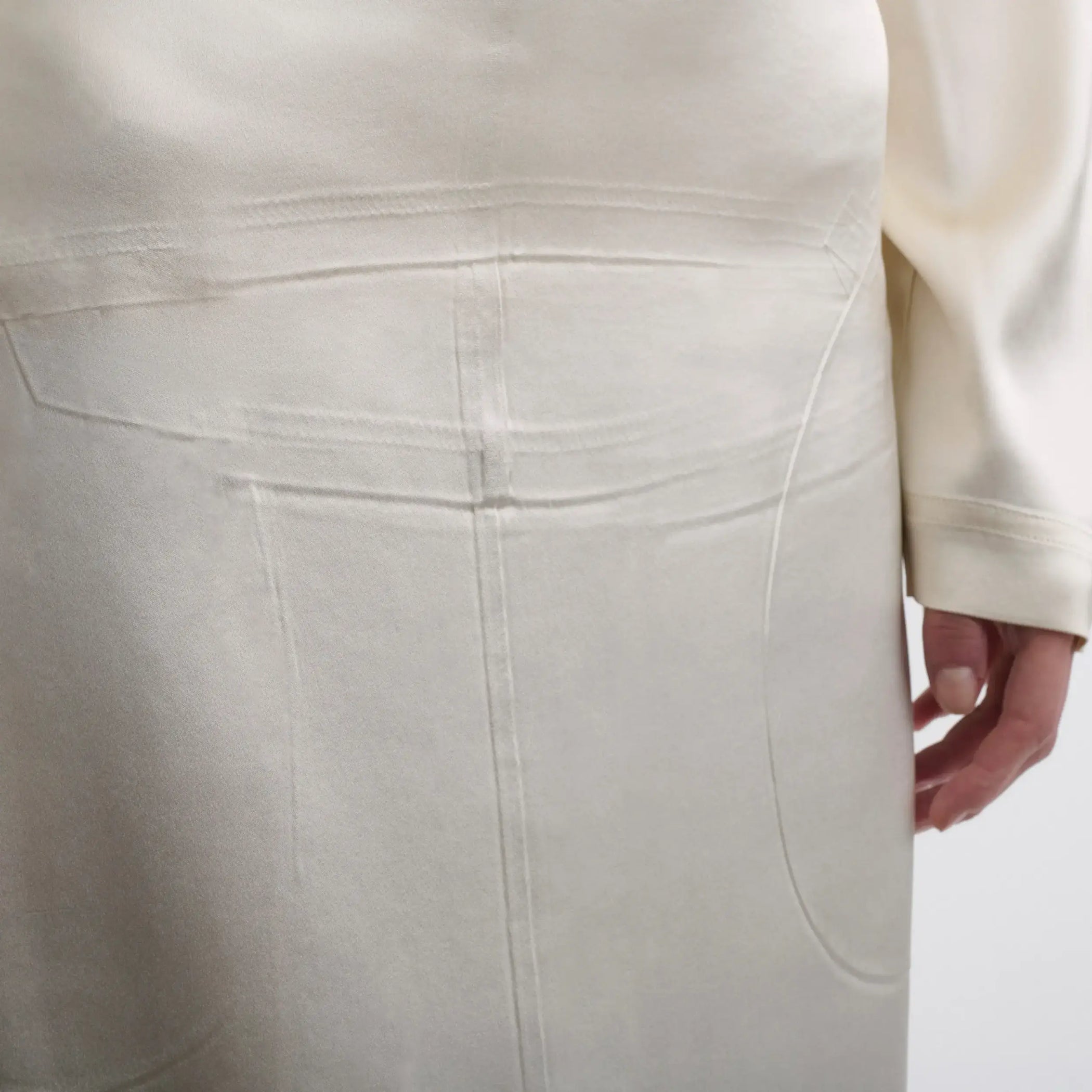 Close up detail view of model wearing LIQUID OPEN BACK DRESS in cream silk satin