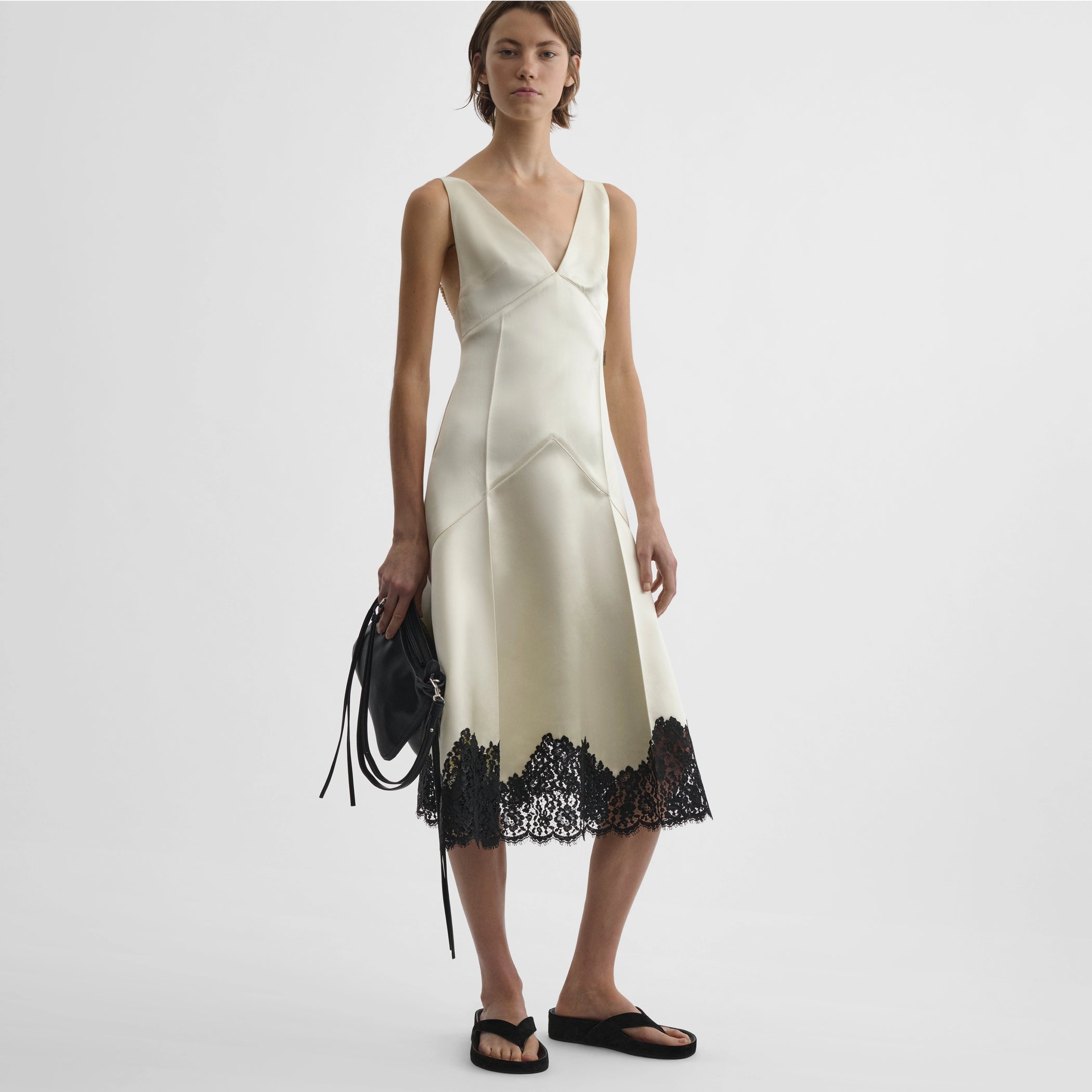 Front view of model wearing the slicked slip in vanilla