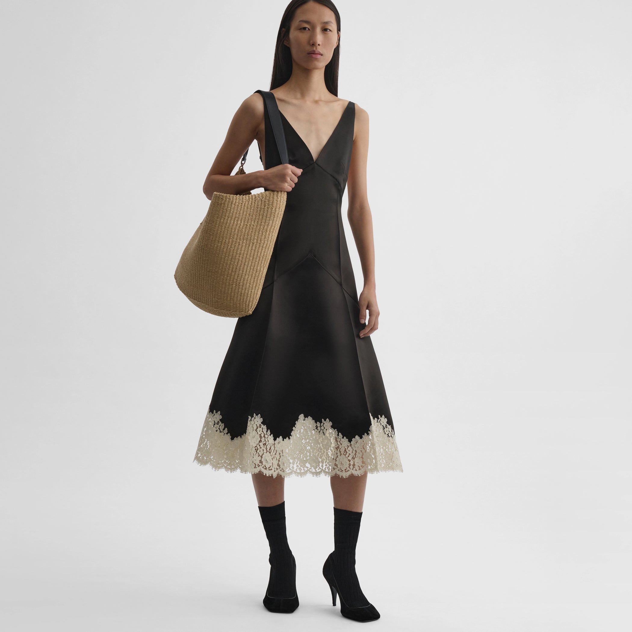 Front view of model wearing the slicked slip in dark khaki
