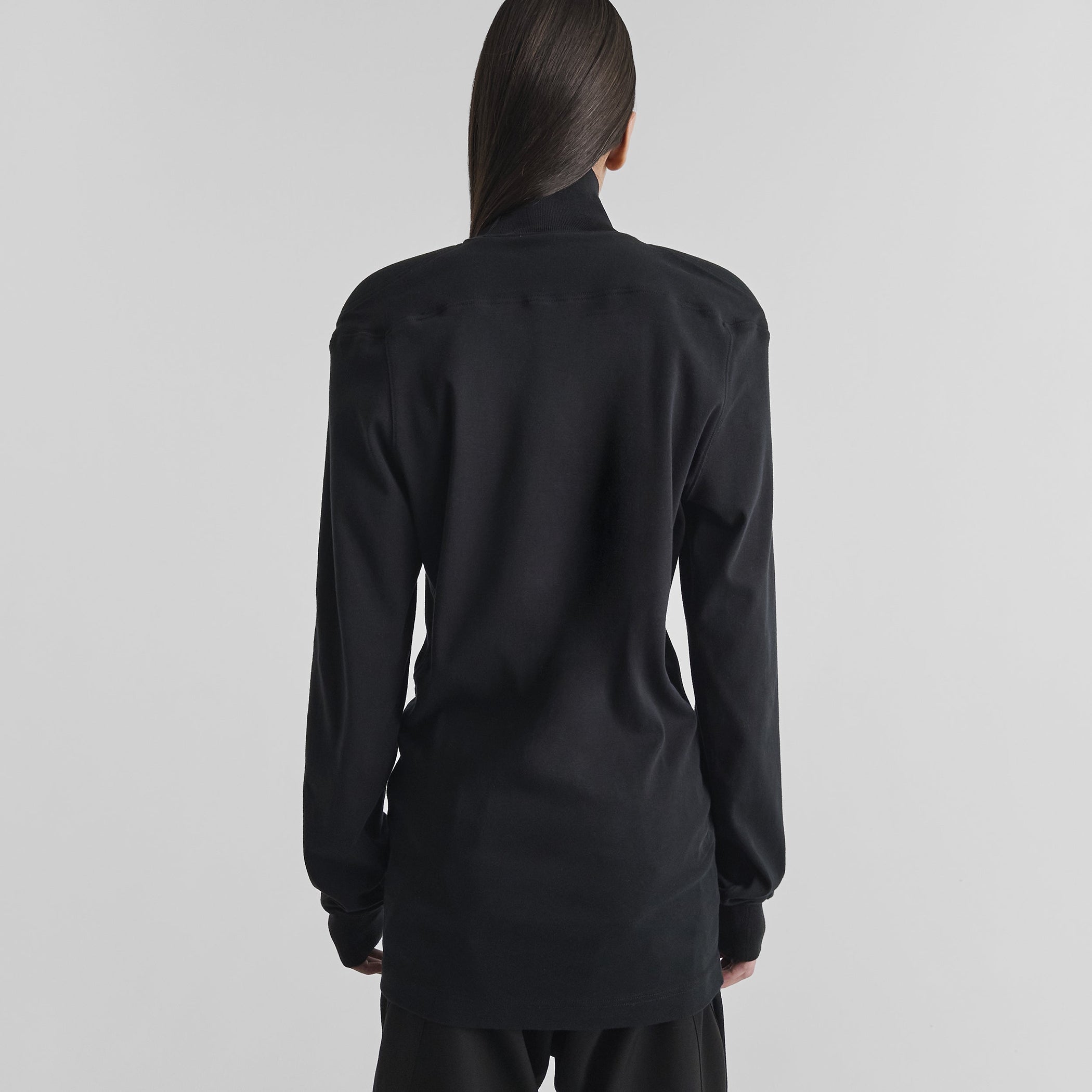 Back view of model wearing SCULPTED T-SHIRT in black cotton jersey