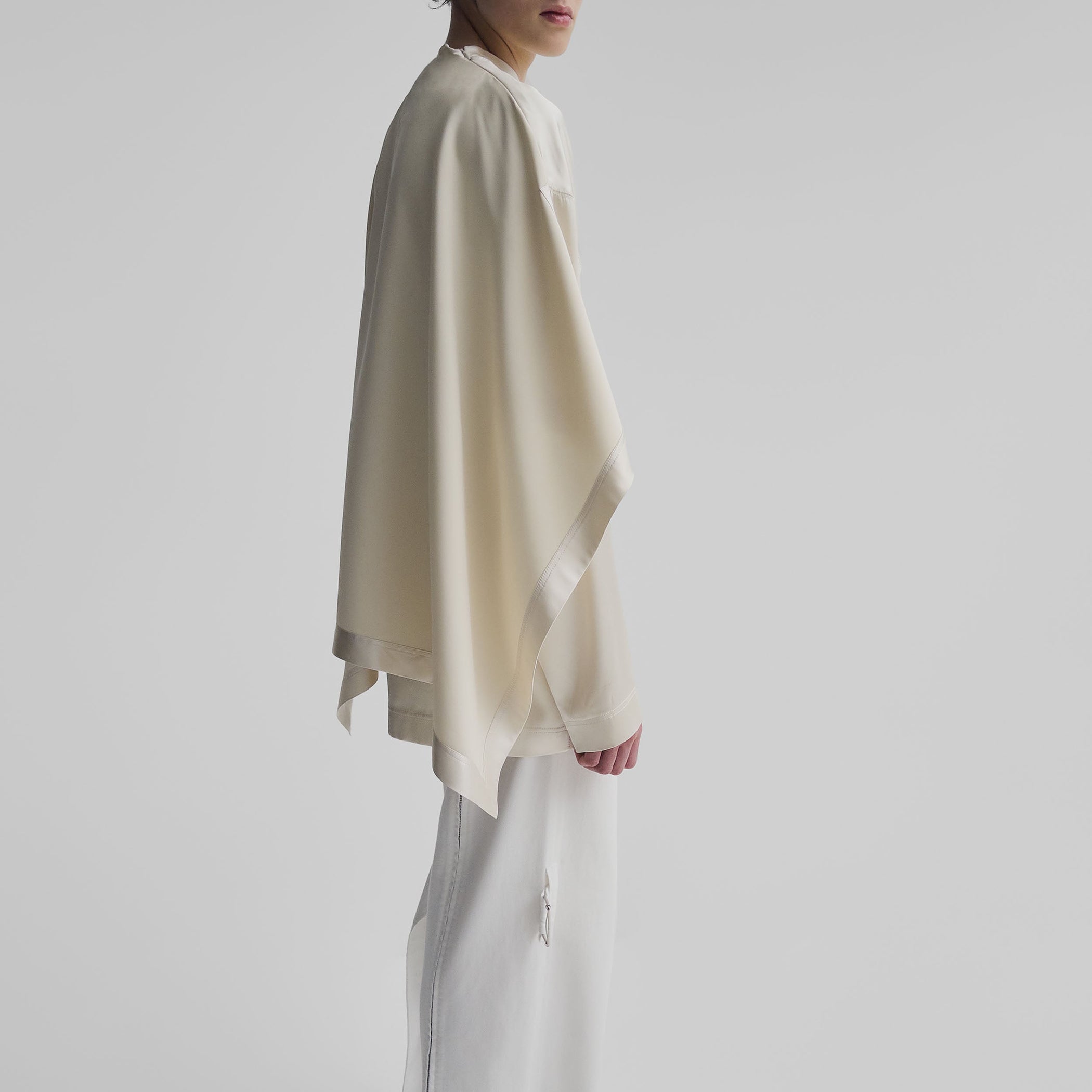 Side view of model wearing SCARF TOP in stucco silk satin
