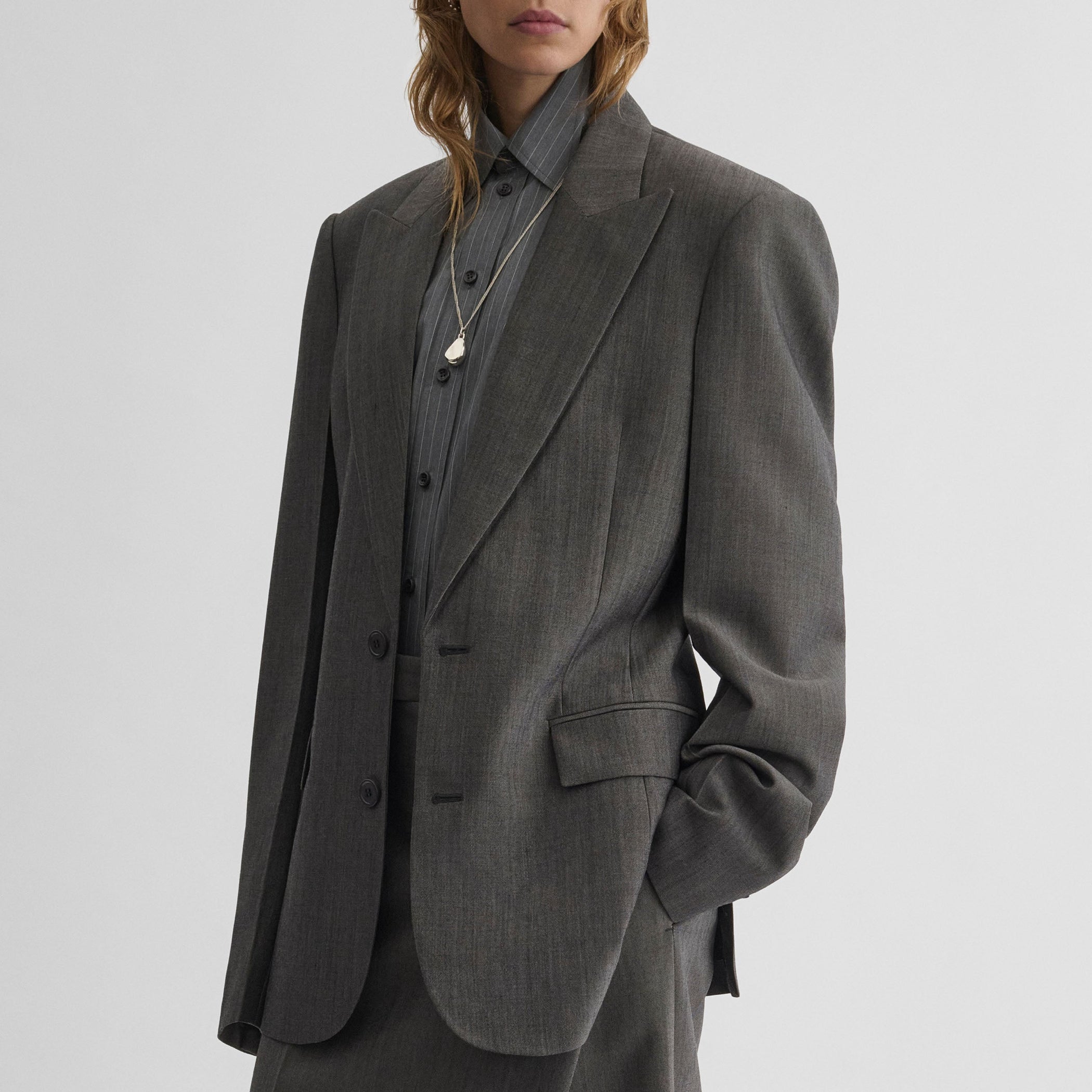 Angled front view of model wearing SINGLE BREASTED JACKET in dark taupe wool