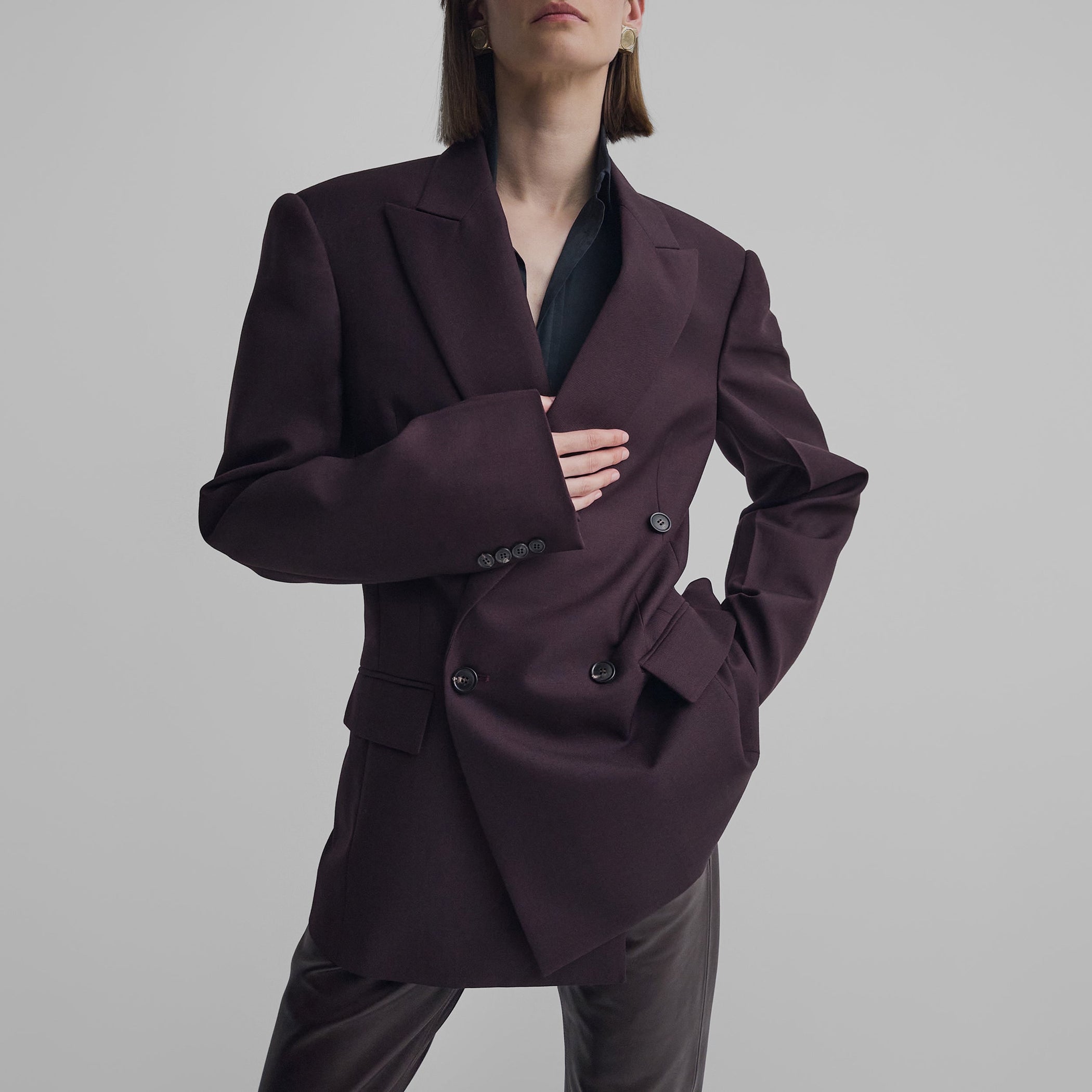 Front view of model wearing MILANESE JACKET in berry wool