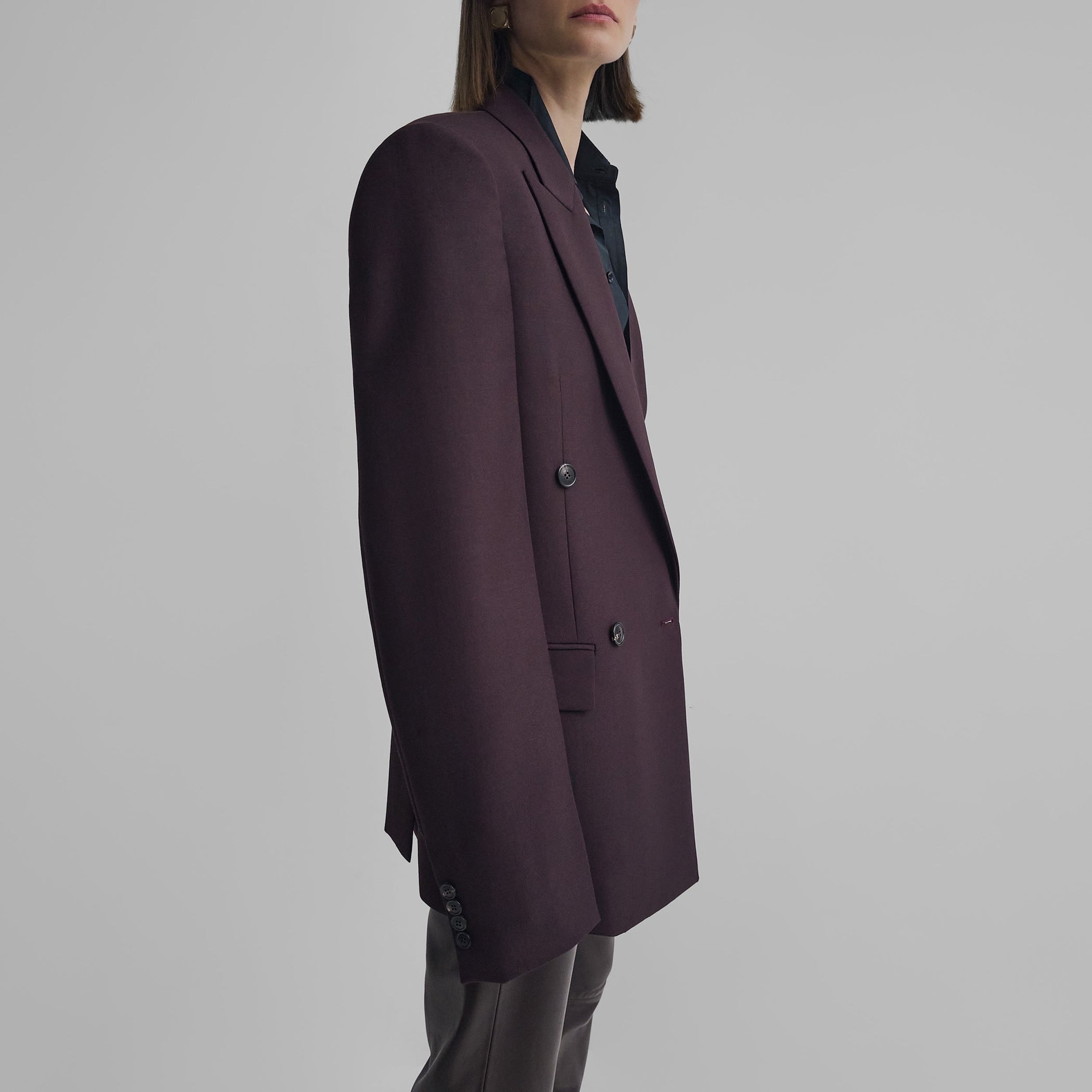 Side view of model wearing MILANESE JACKET in berry wool