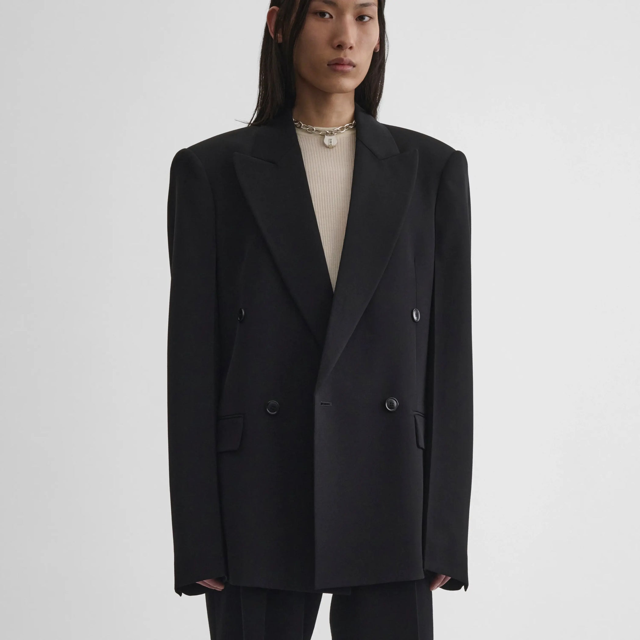 Front view of model wearing Milanese Jacket in black.