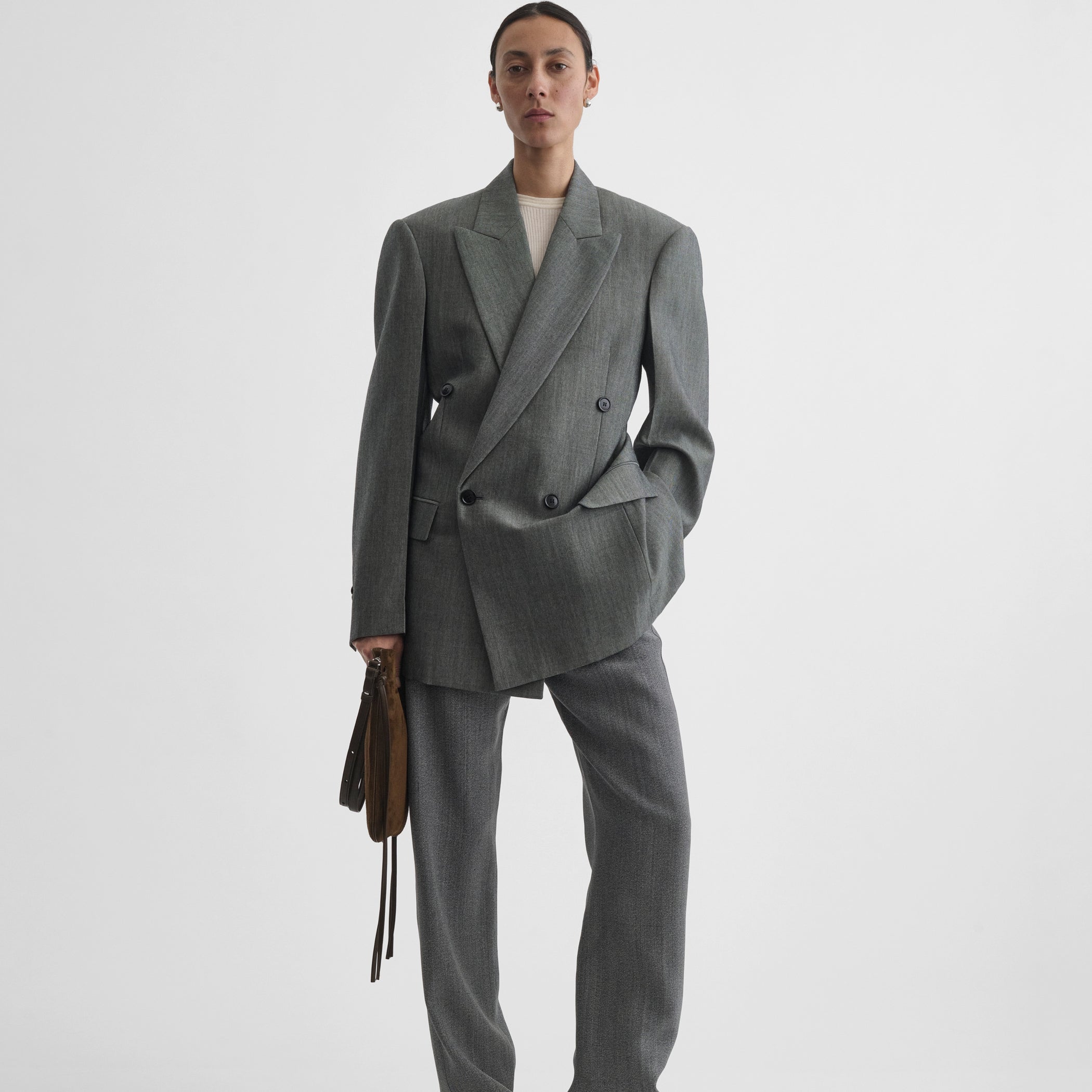 Front view of model wearing milanese jacket in dark taupe wool