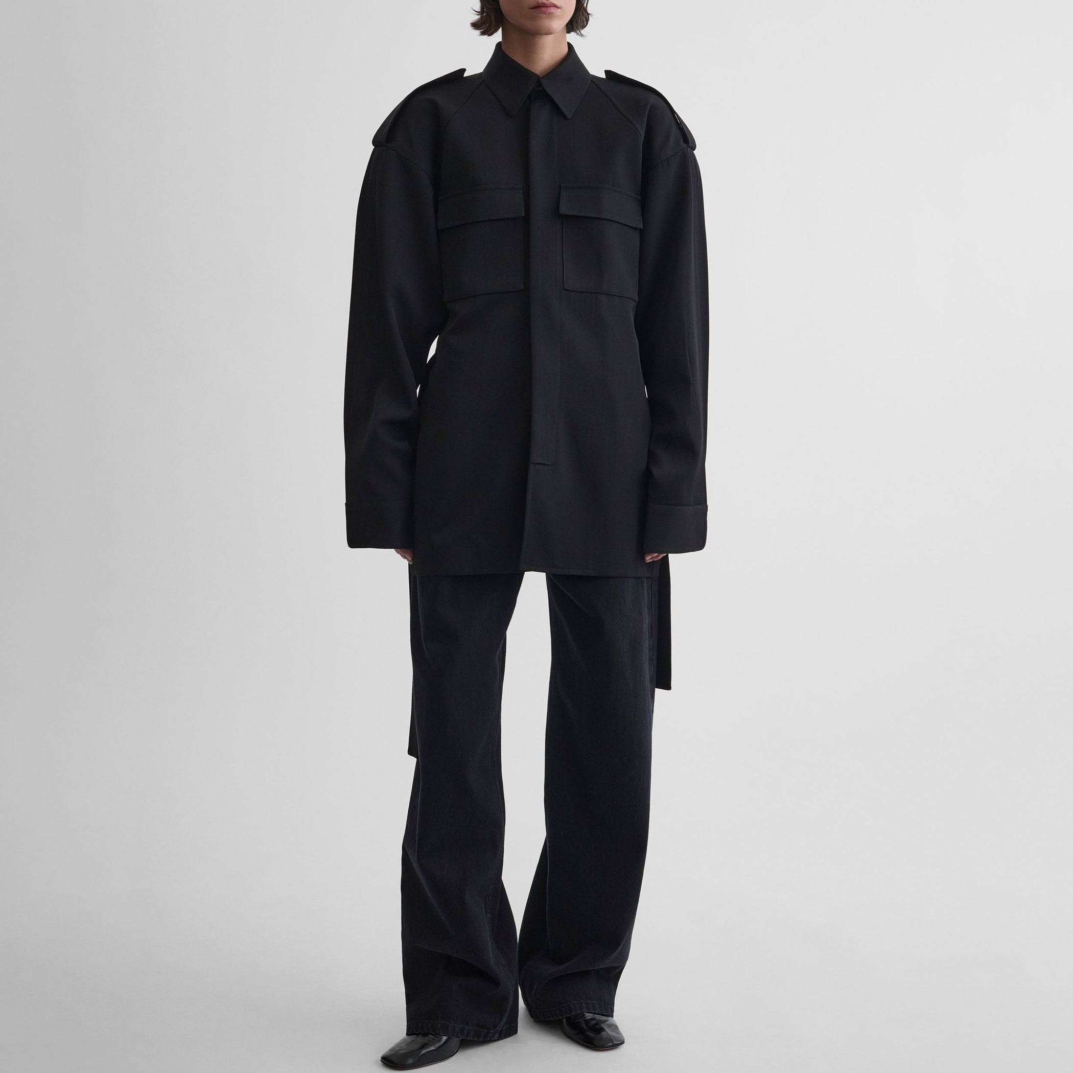 Front view of model wearing LIGHTWEIGHT SHIRT JACKET in black wool