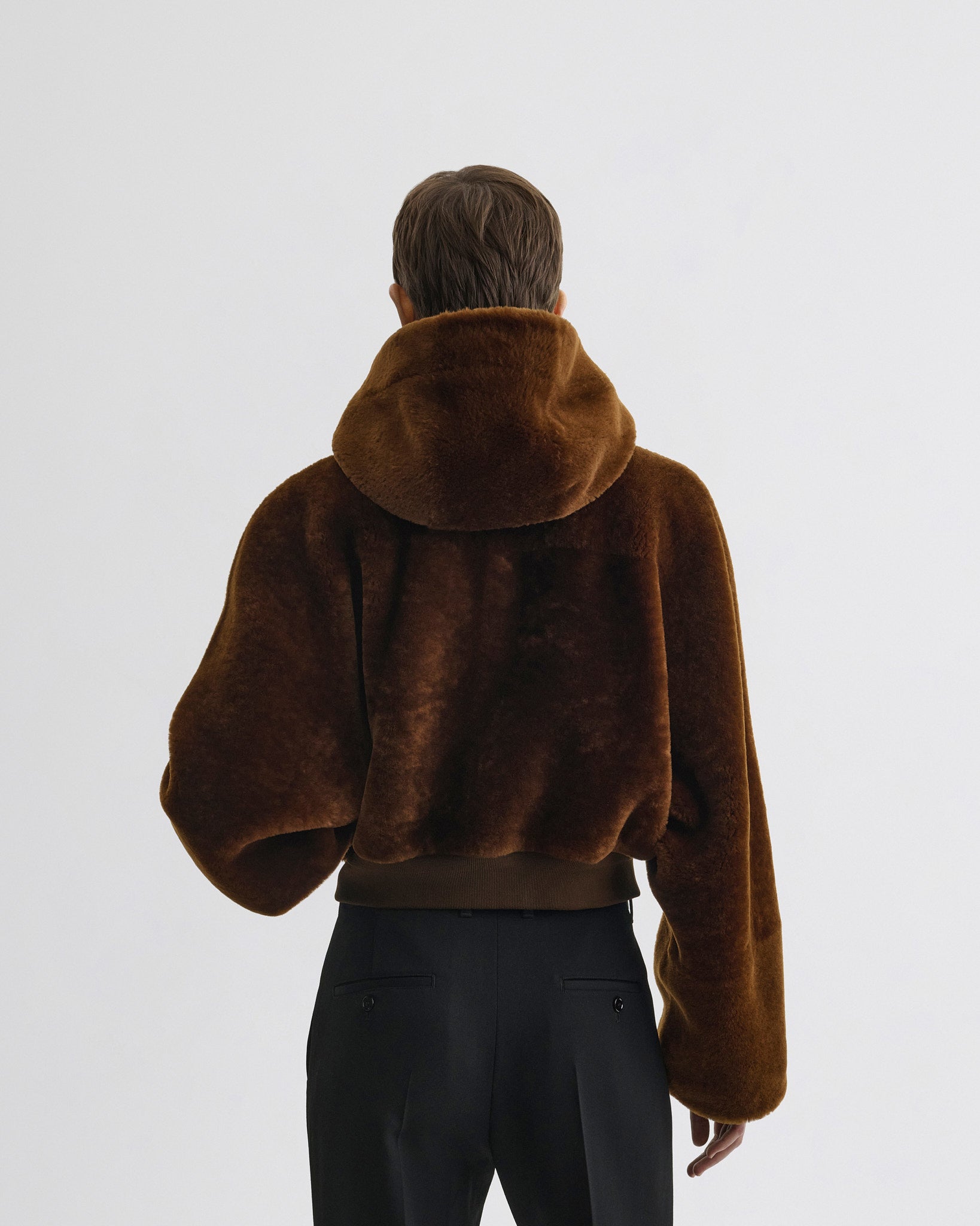 Back view of model wearing Super Soft Bomber Jacket in ginger shearling