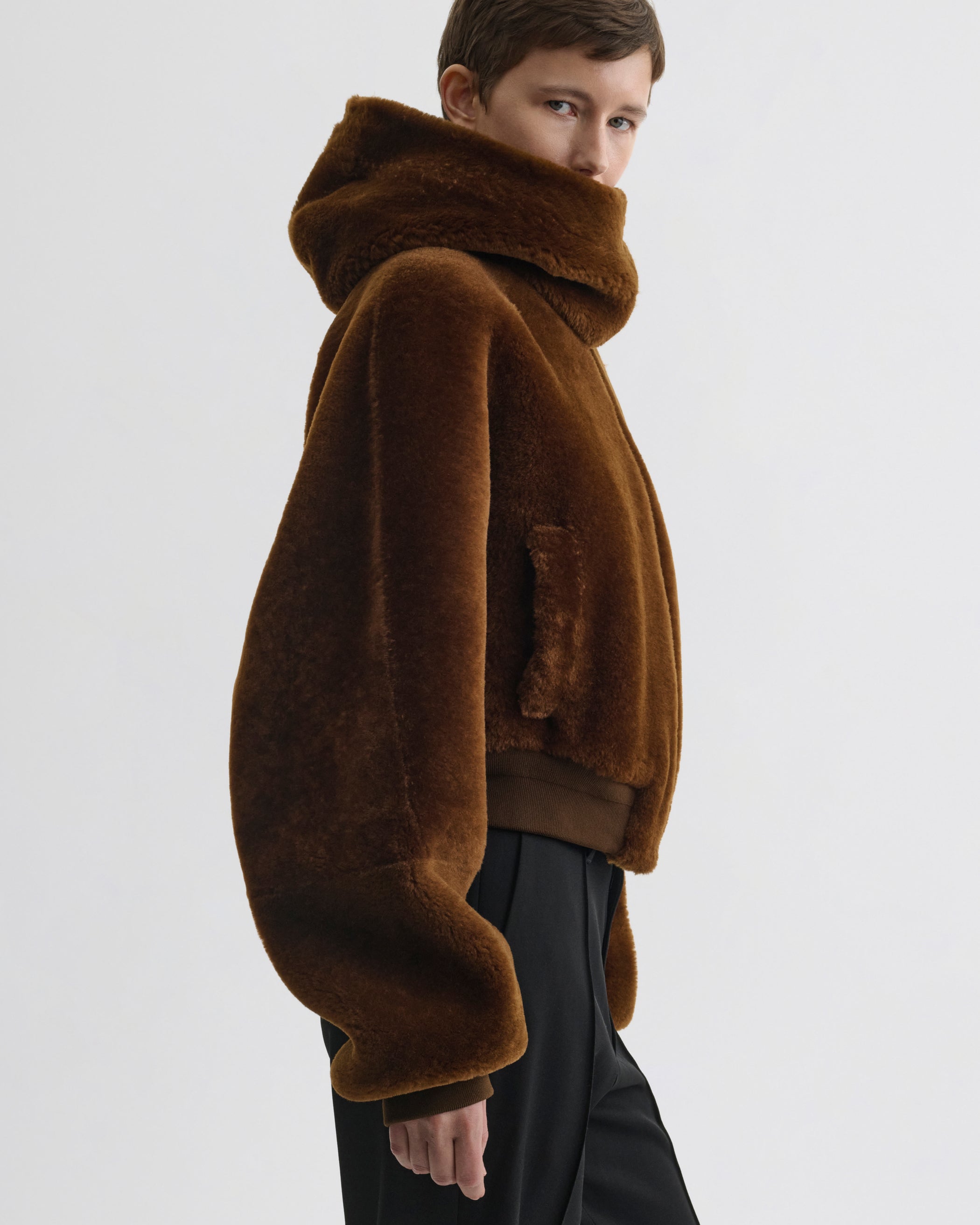 Side view of model wearing Super Soft Bomber Jacket in ginger shearling