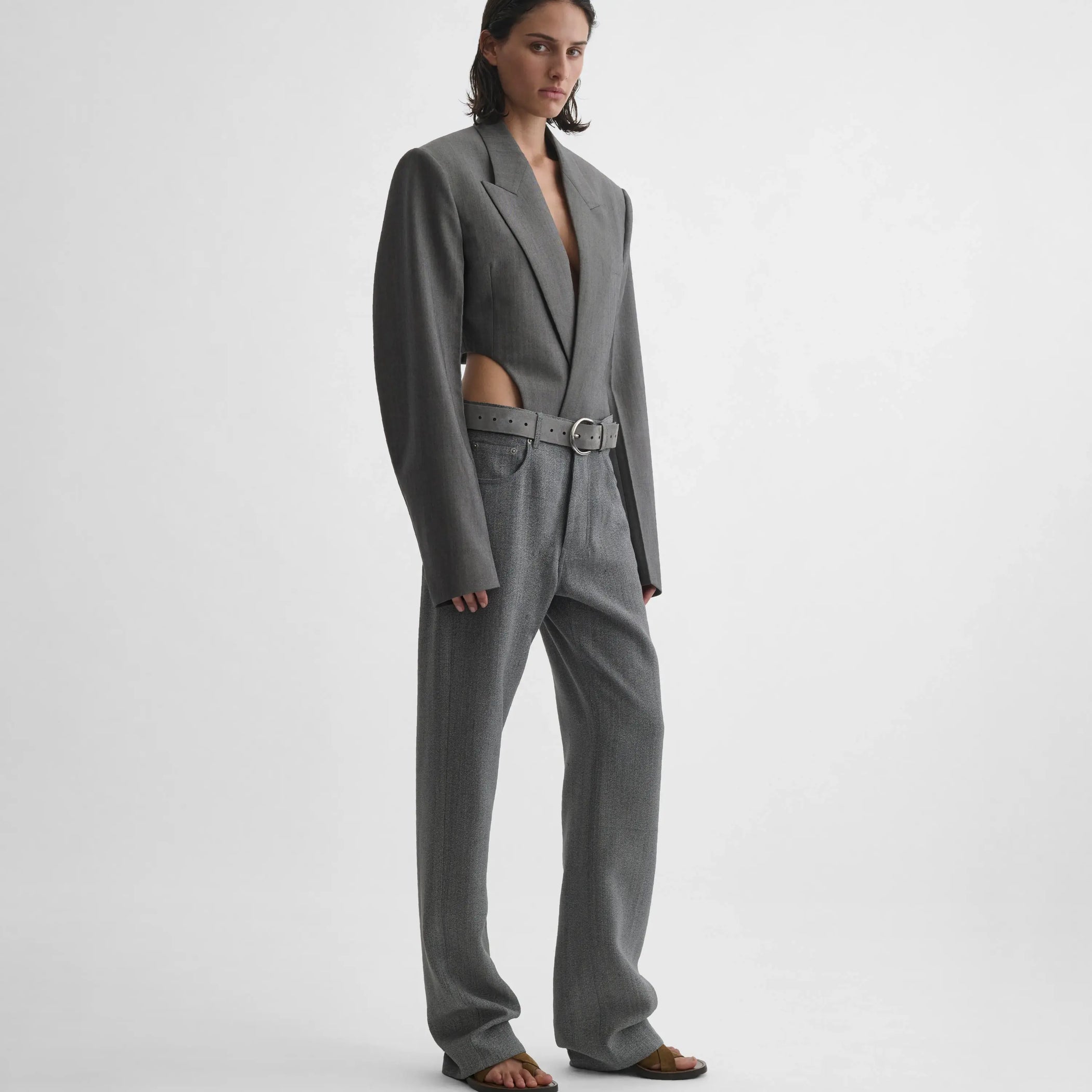 Full body view of model wearing Tucked Tailored Jacket in dark taupe.