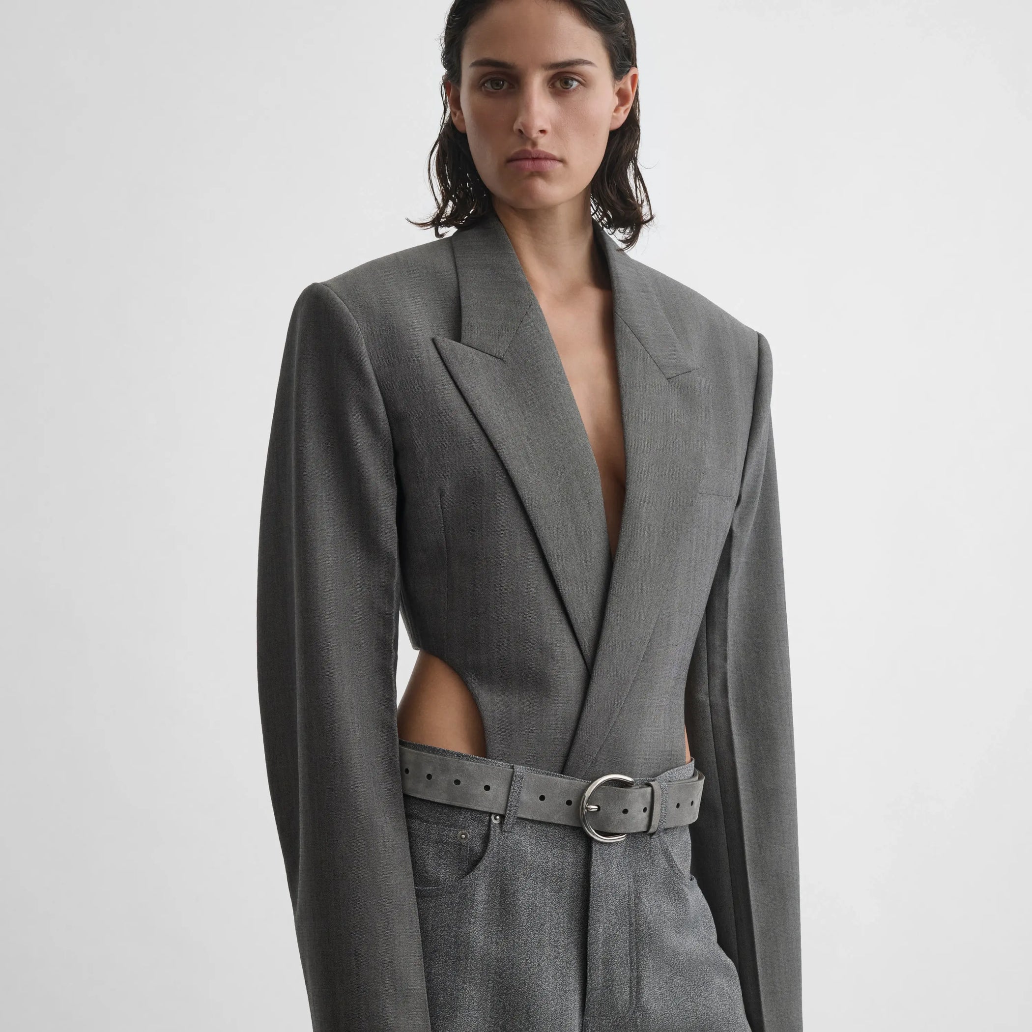 Front view of model wearing Tucked Tailored Jacket in dark taupe.