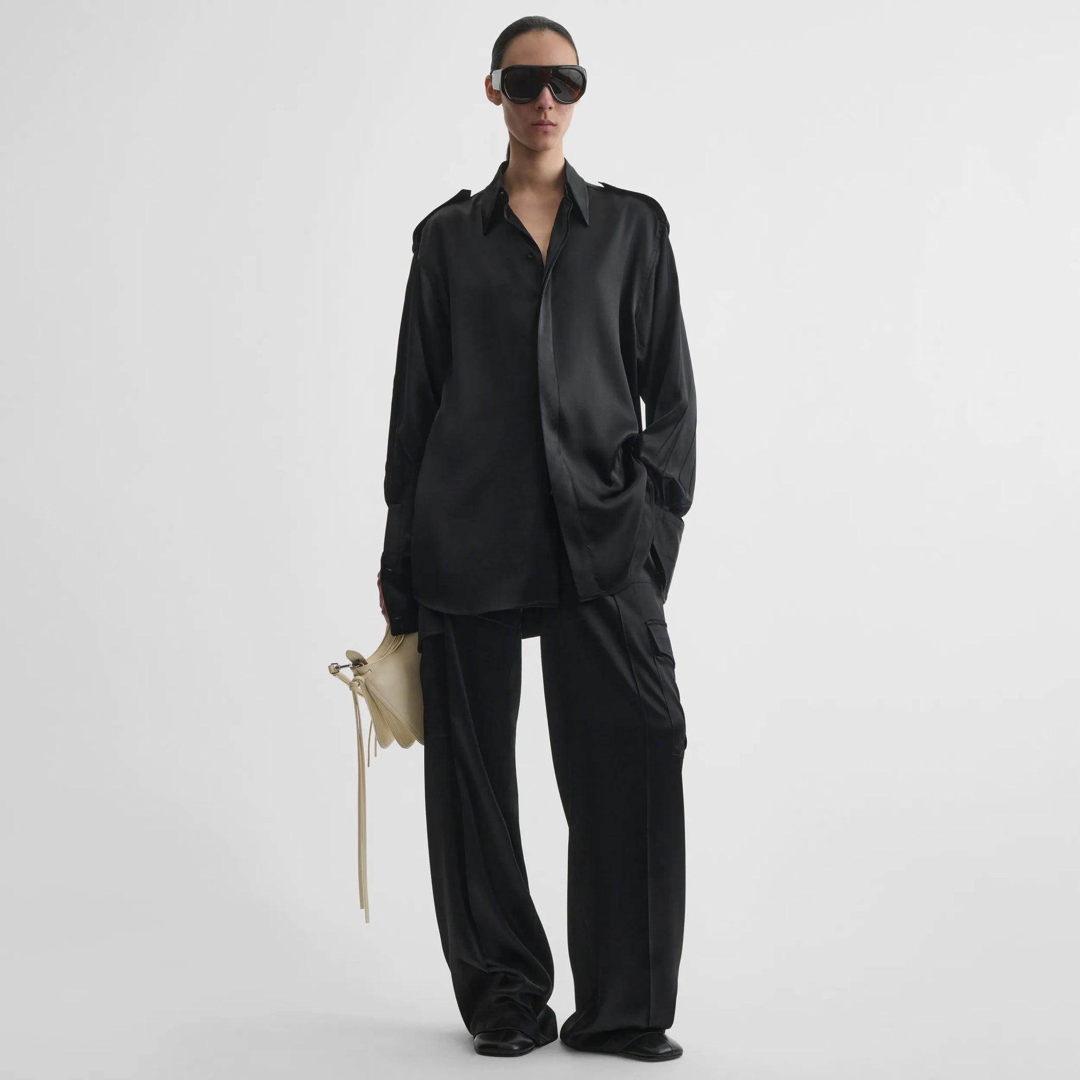 Front model view of liquid utility shirt in black silk satin