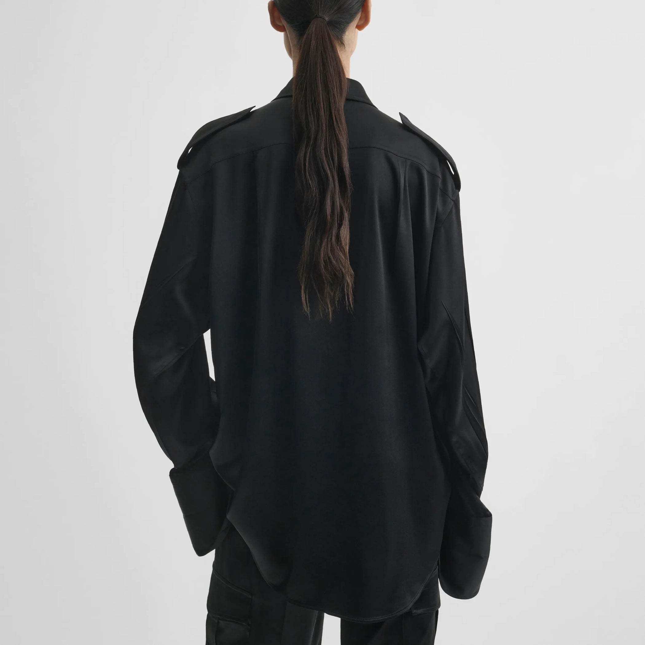 Back model view of liquid utility shirt in black silk satin