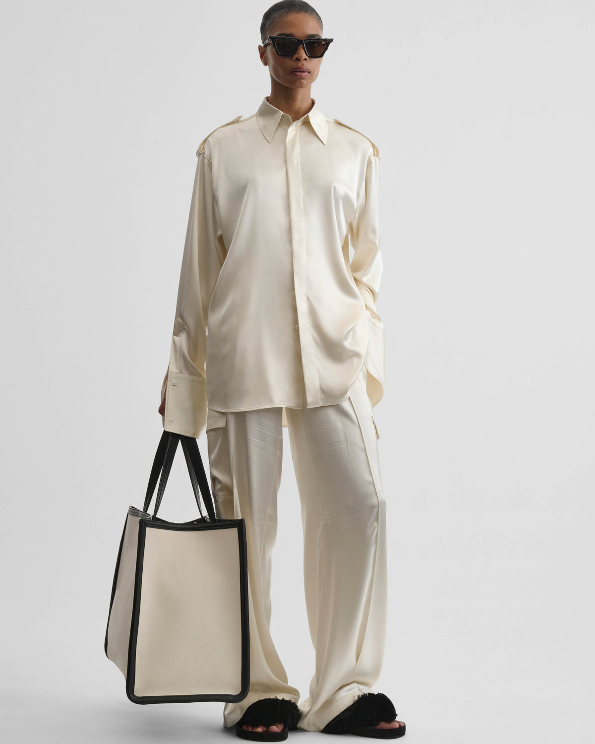 Front view of model wearing LIQUID UTILITY SHIRT in cream silk satin