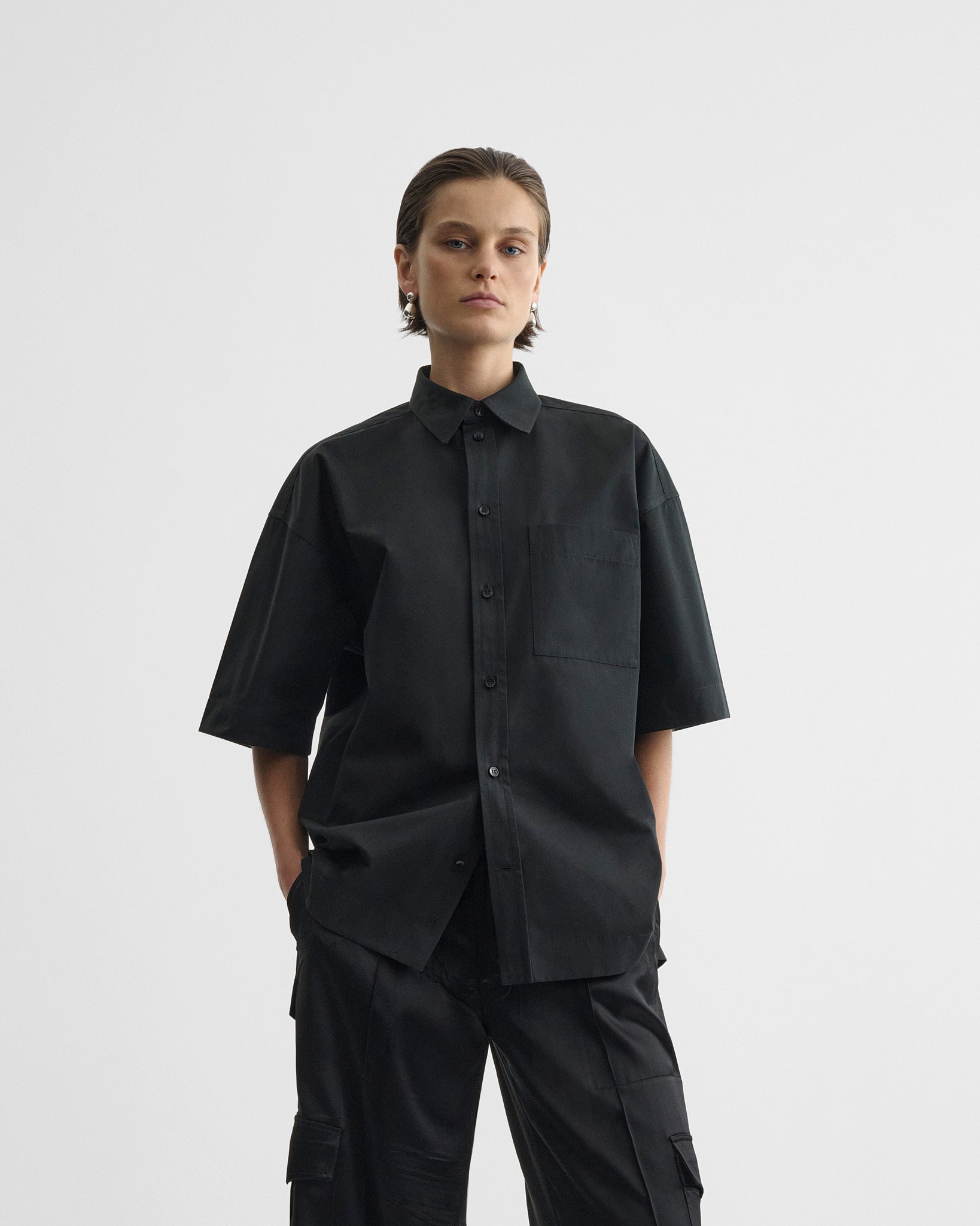 Front view of short sleeve shirt in black cotton