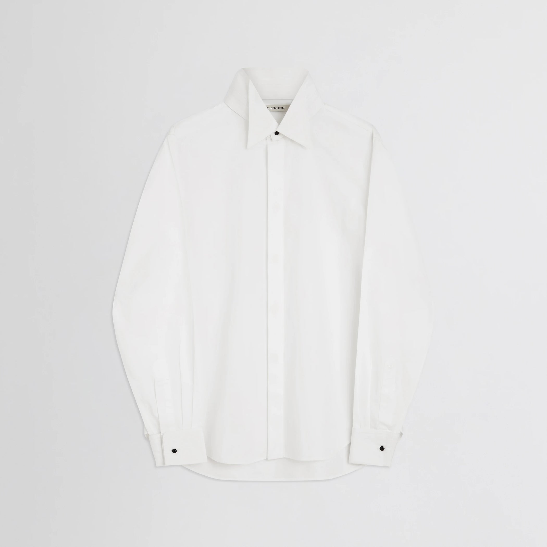 Flat front view of tuxedo shirt in white cotton.
