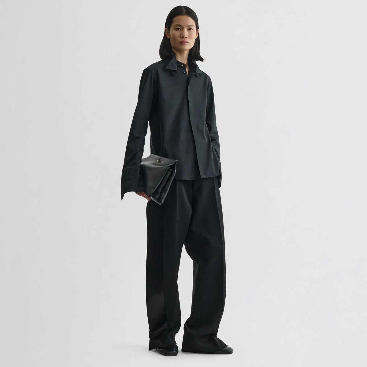 Front view of model wearing tuxedo shirt in black cotton