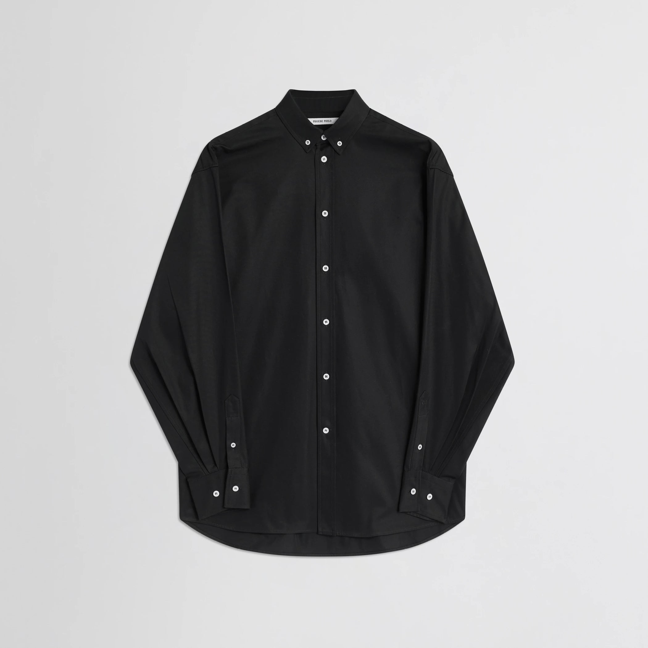 Flat front view of button collar shirt in black cotton.